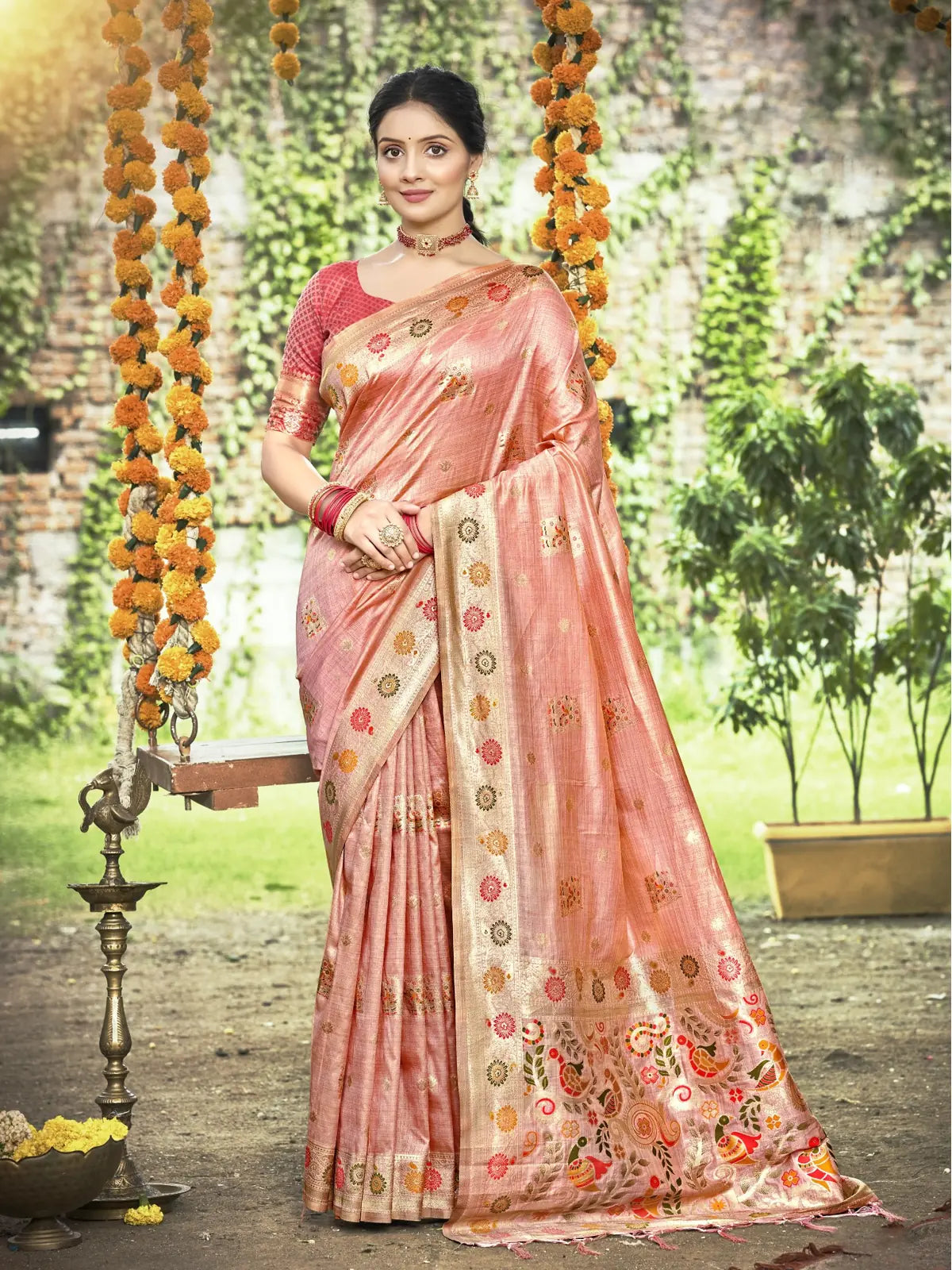 Tarani peach silk saree full view with golden zari border and floral motifs for festive and wedding wear