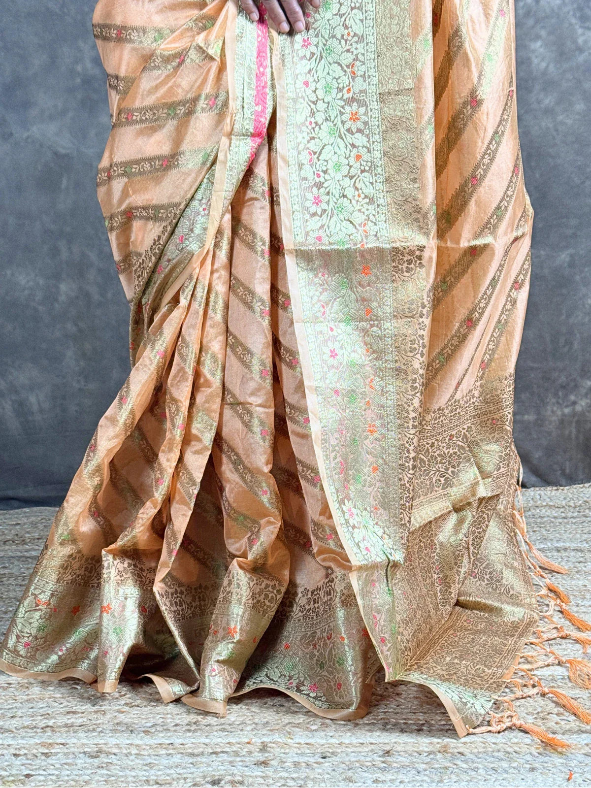 Tarani golden silk saree pallu view with intricate woven border and rich detailing