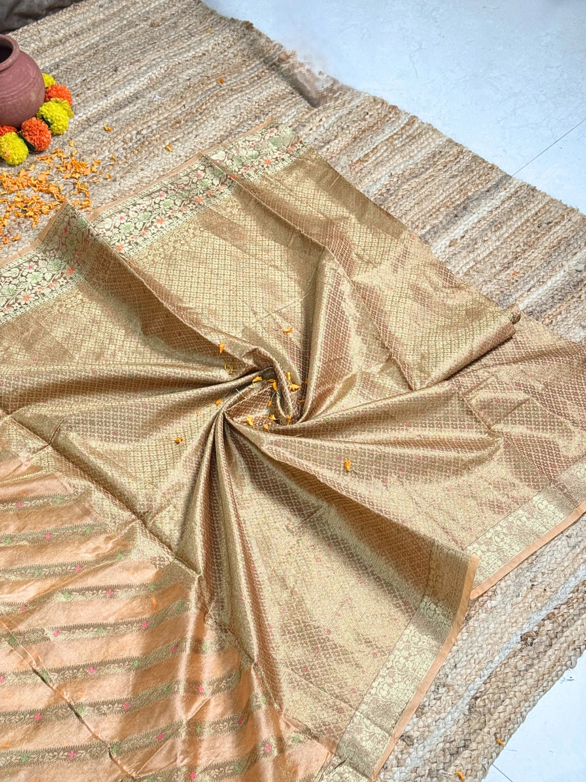 Tarani golden silk saree closeup view showing delicate weaving and fabric texture