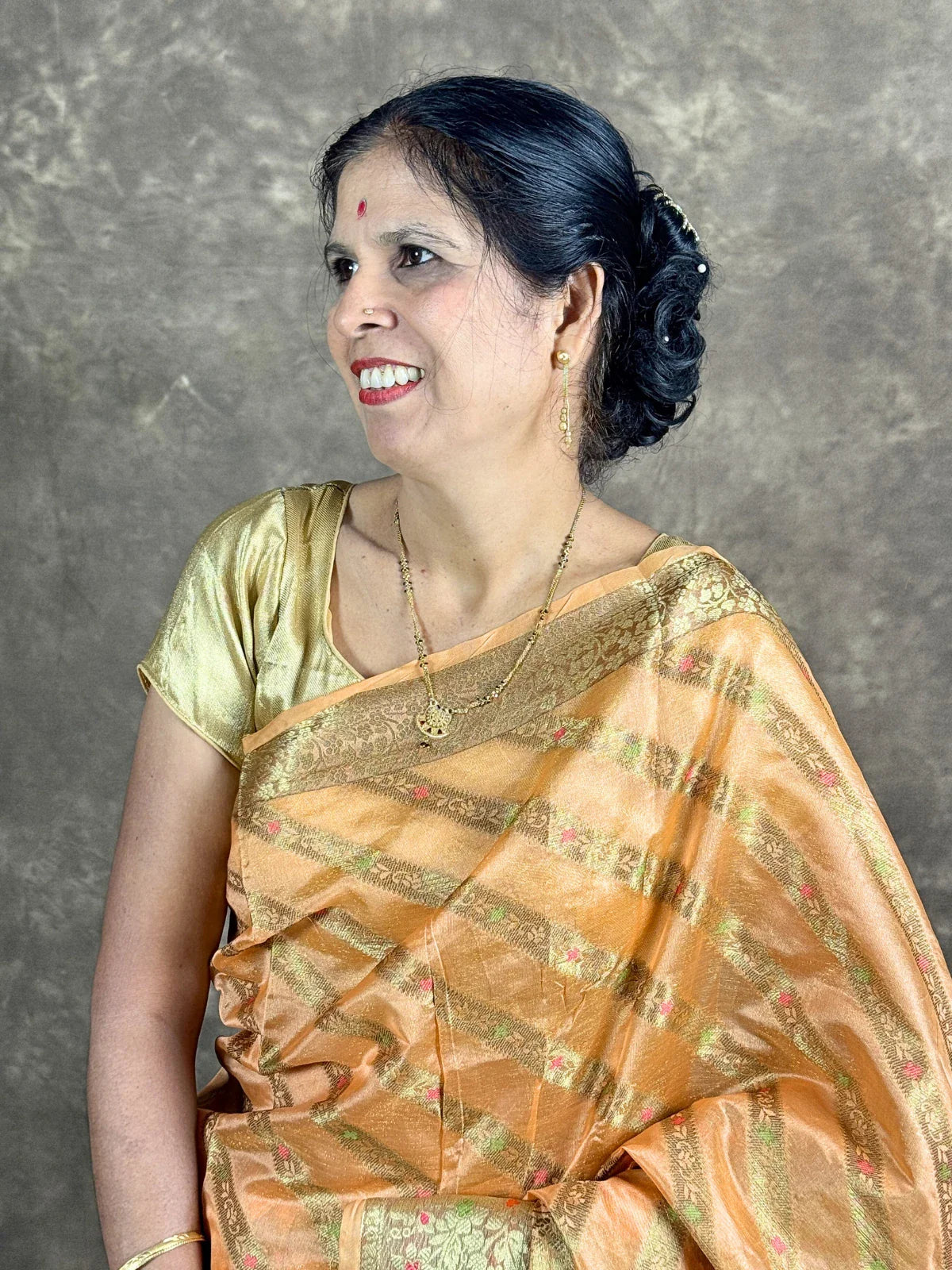 Tarani golden silk saree upper body view highlighting woven detailing and festive design