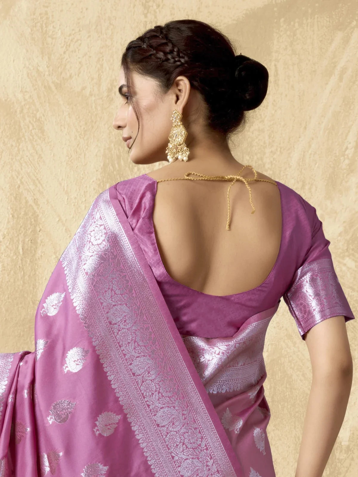 Tarani pink silk saree back view highlighting blouse design and zari border