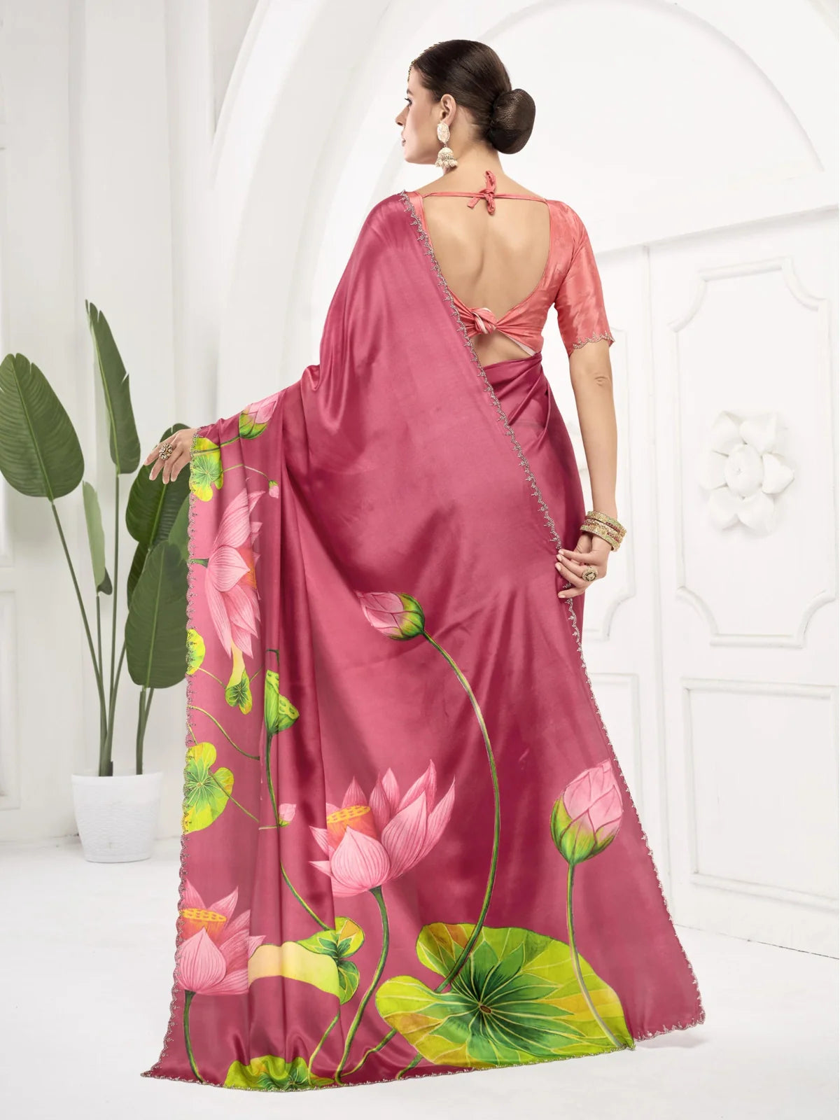 Tarani designer saree back view with stylish blouse tie pattern