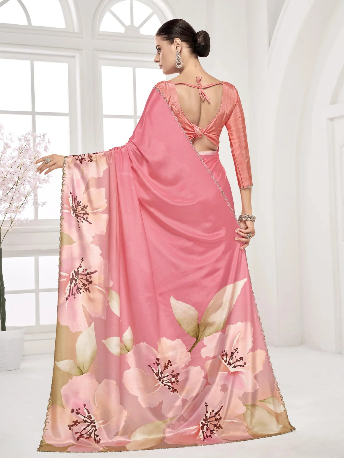 Tarani saree back view showing tied blouse design and flowing pink digital print pallu