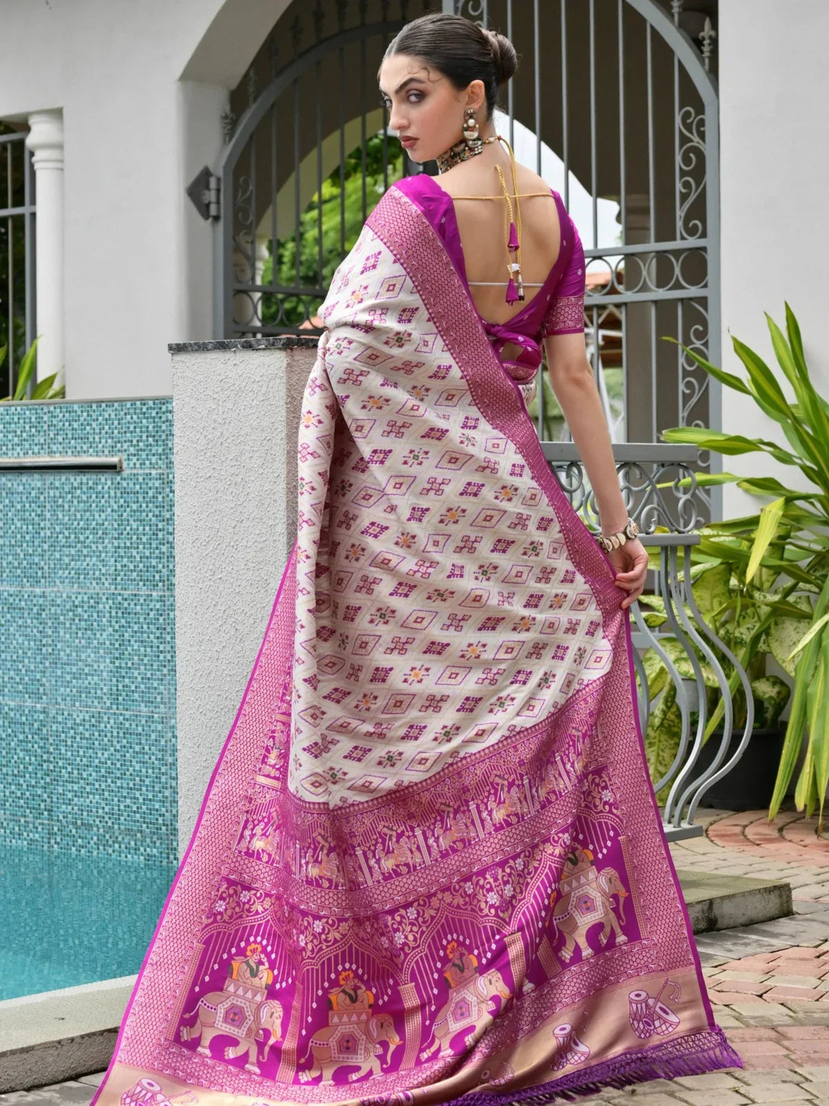 Tarani full back view of saree drape highlighting tassel blouse and detailed pallu design