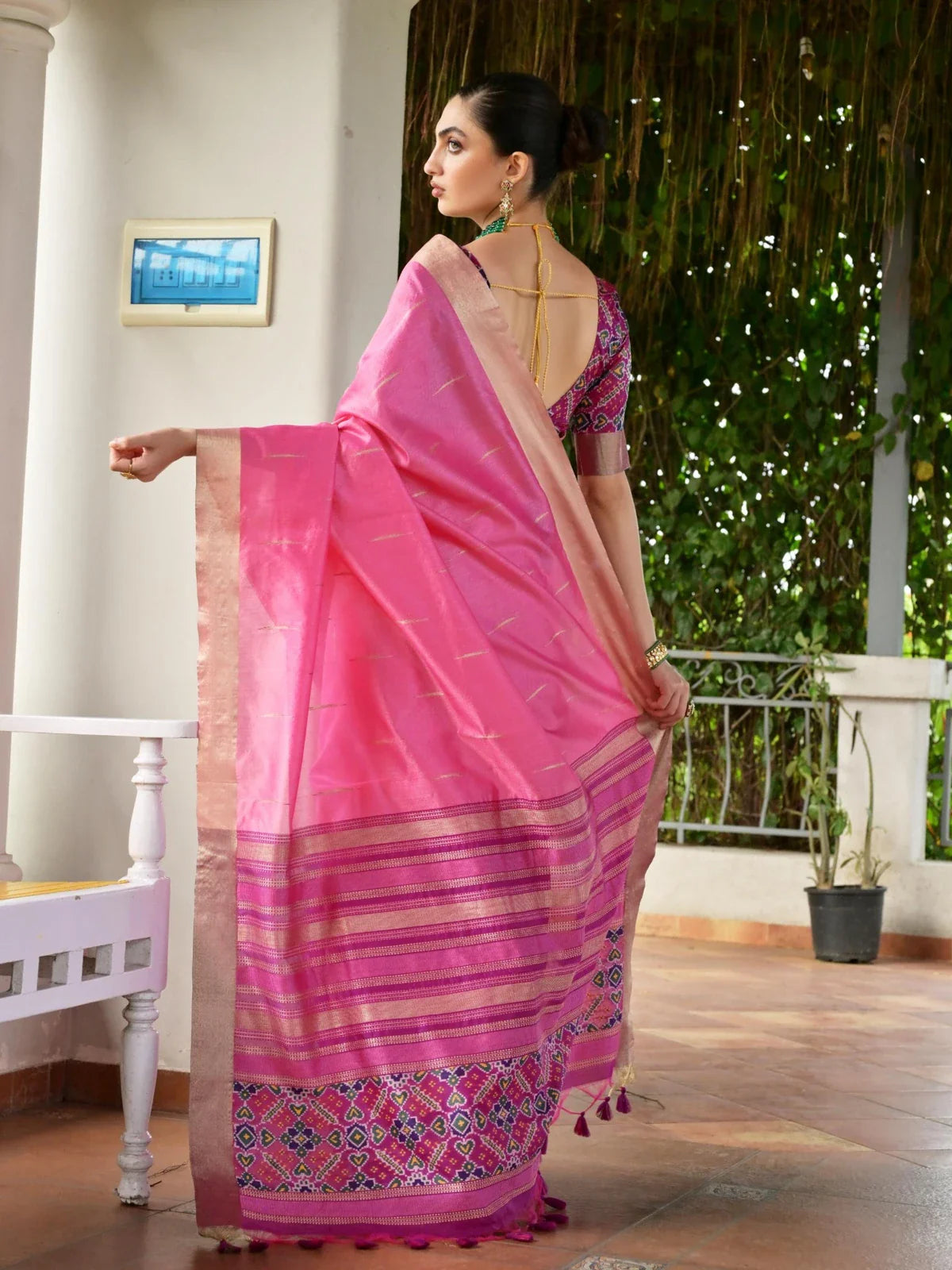 Tarani pink silk saree contrast back blouse view with deep back tie-up and ikkat pattern in purple tones