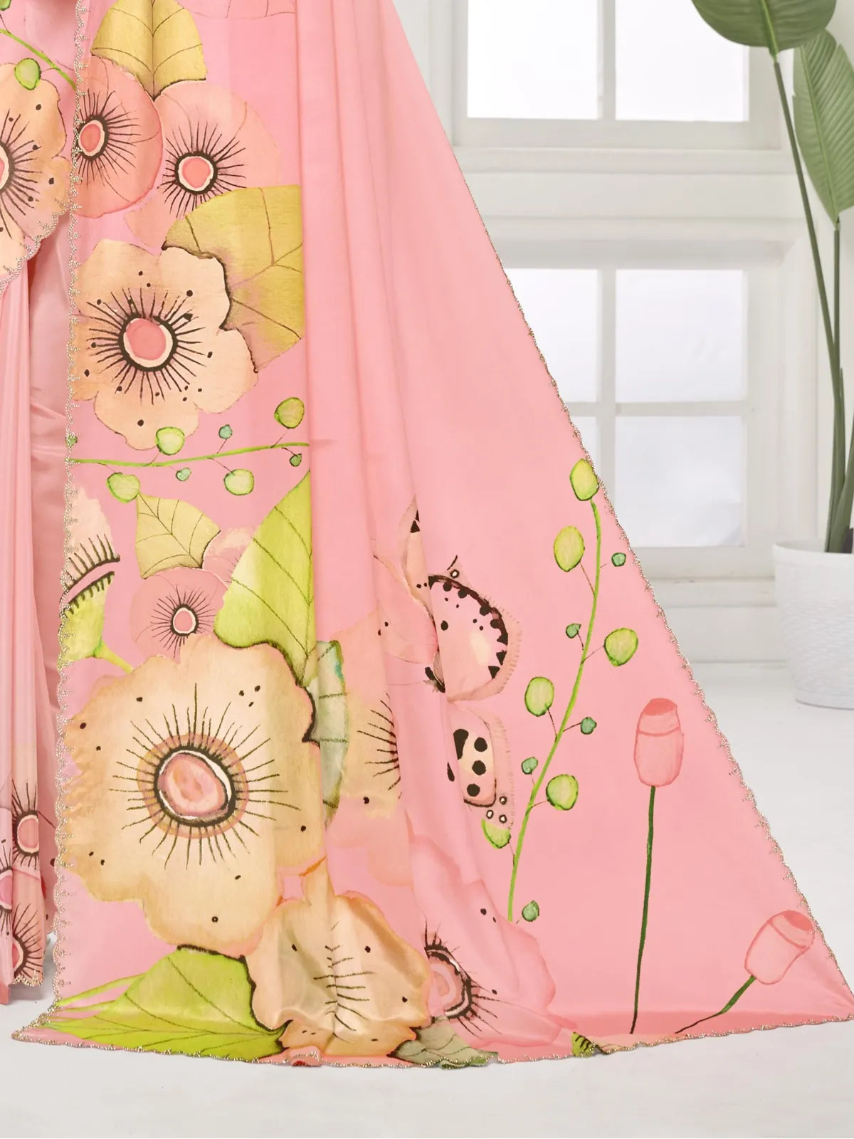 Tarani pink digital silk saree close-up showing floral prints and crystal border