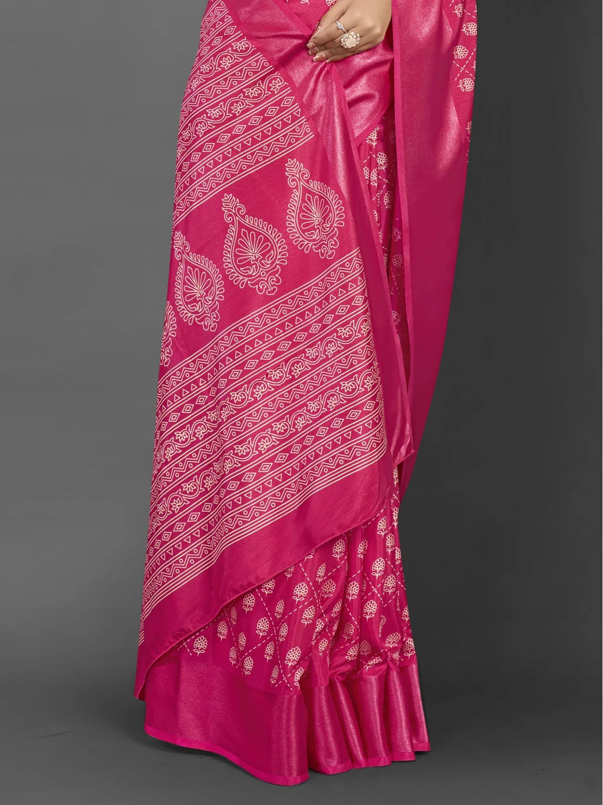 Tarani pink Dola silk saree closeup showing rich woven detailing and smooth fabric texture