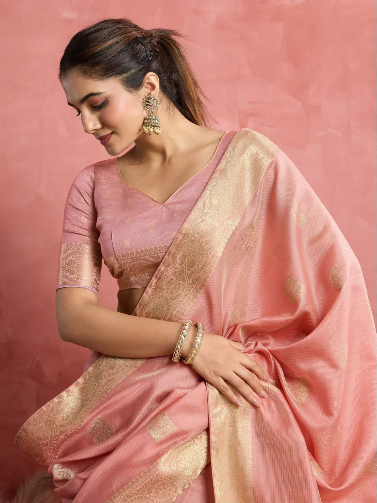 Tarani pink silk saree front view with elegant woven border and blouse