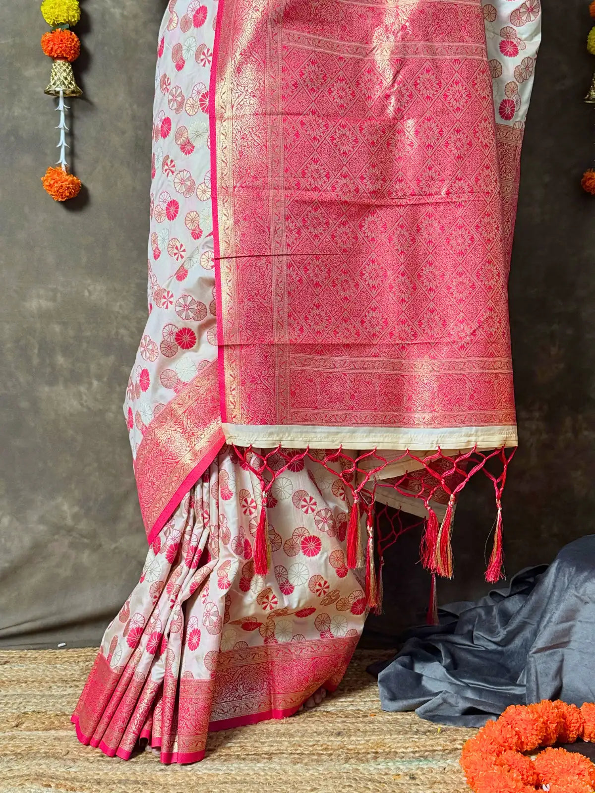 Tarani festive pink silk saree pallu view with zari detailing and tassels