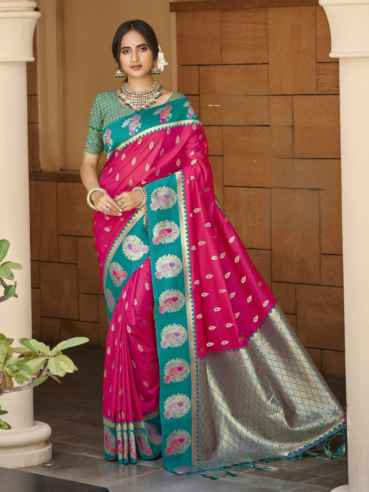 Tarani pink silk saree with zari weaving and teal contrast border full view for wedding wear