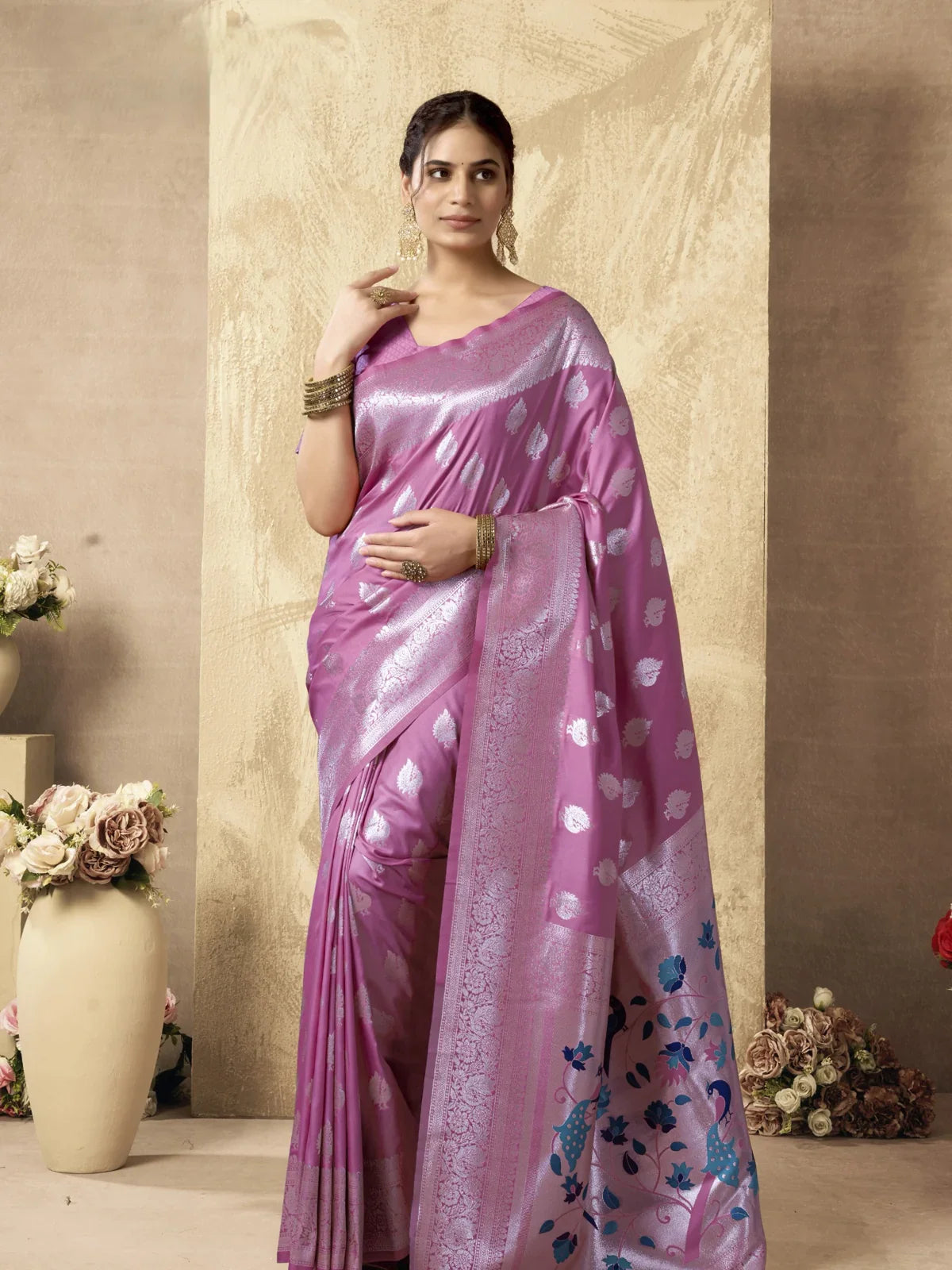 Tarani pink silk saree full view with silver zari motifs and peacock pallu design