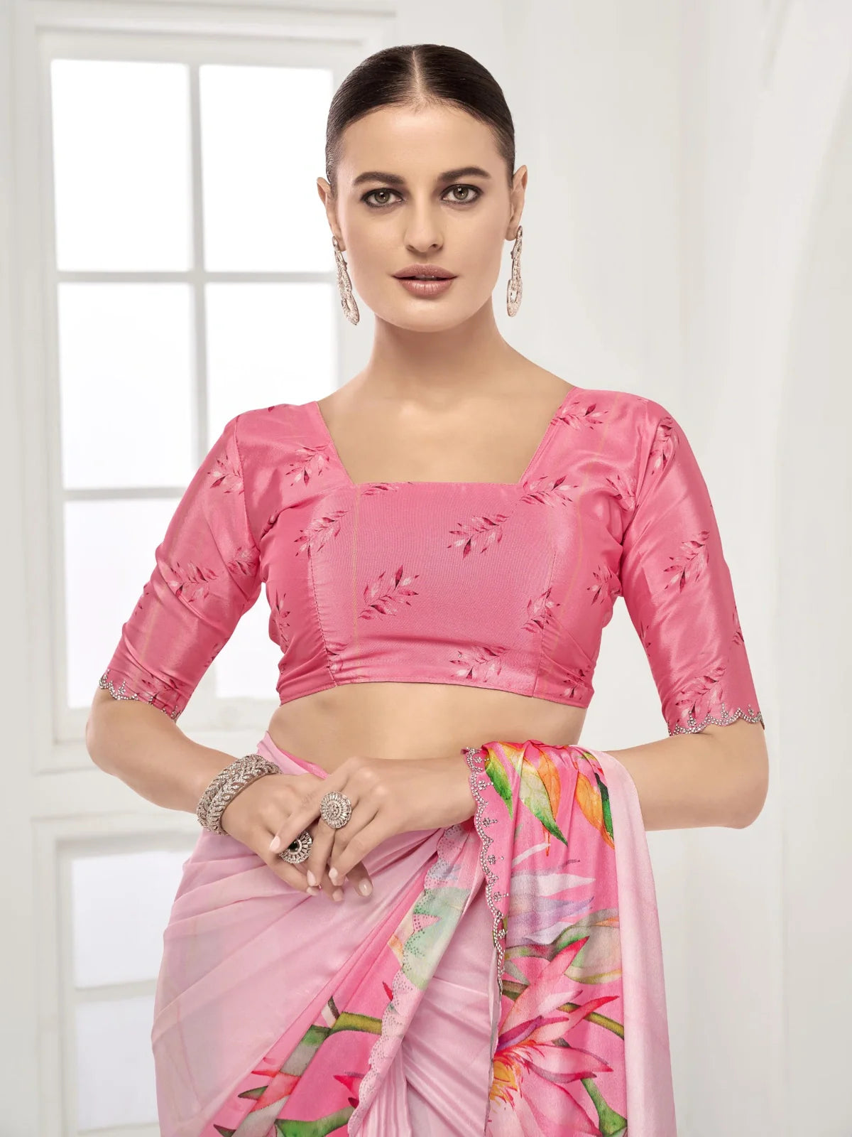 Tarani designer pink saree with soft floral motifs and crystal embellished edge