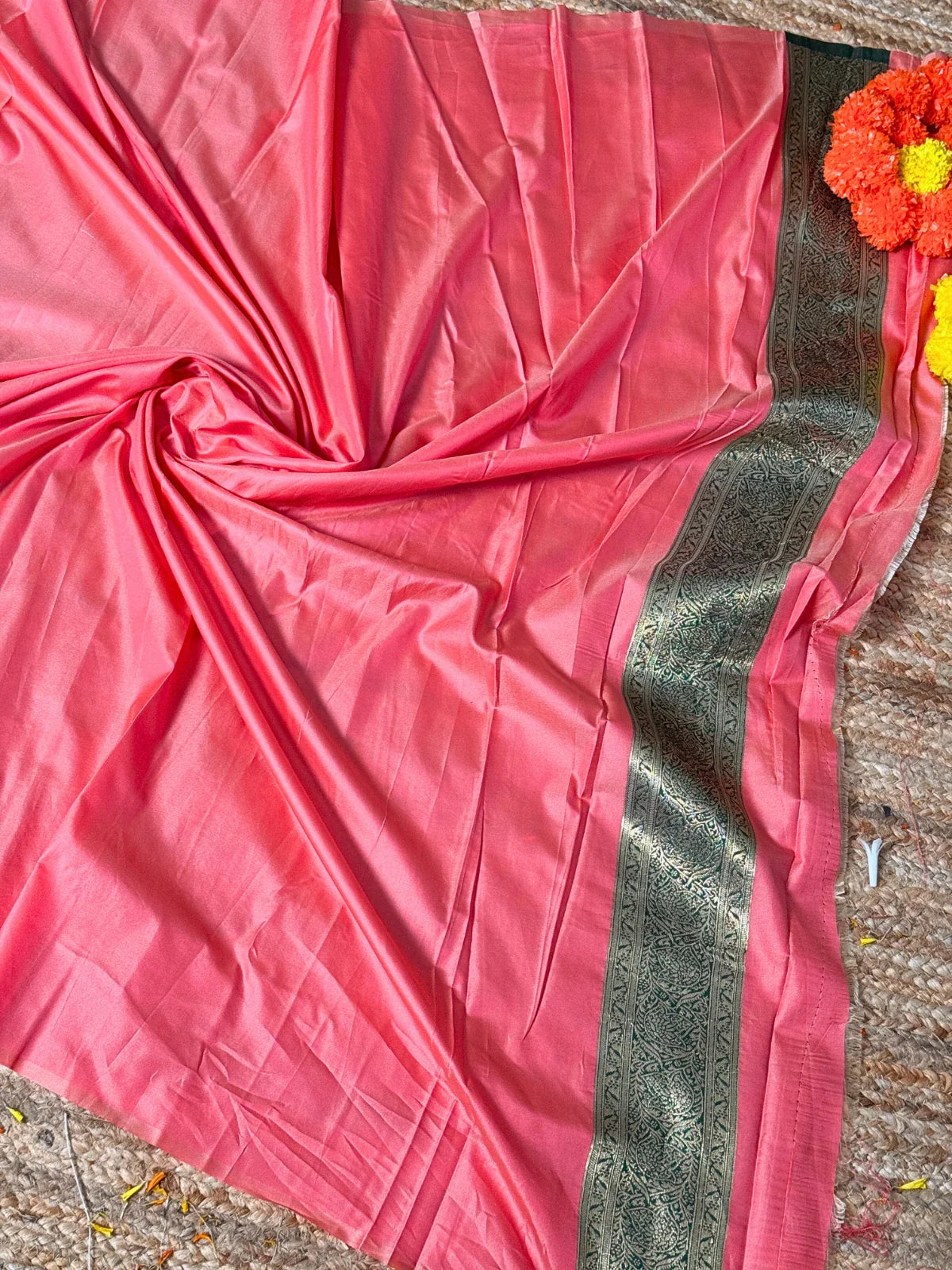 Tarani pink silk saree pallu view highlighting zari work and border design