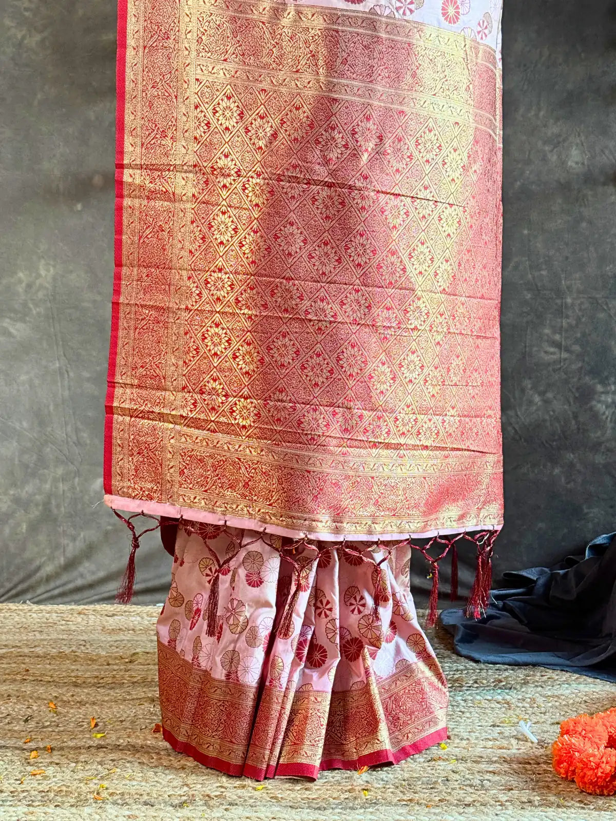 Tarani pink silk saree closeup pallu and golden zari border festive style