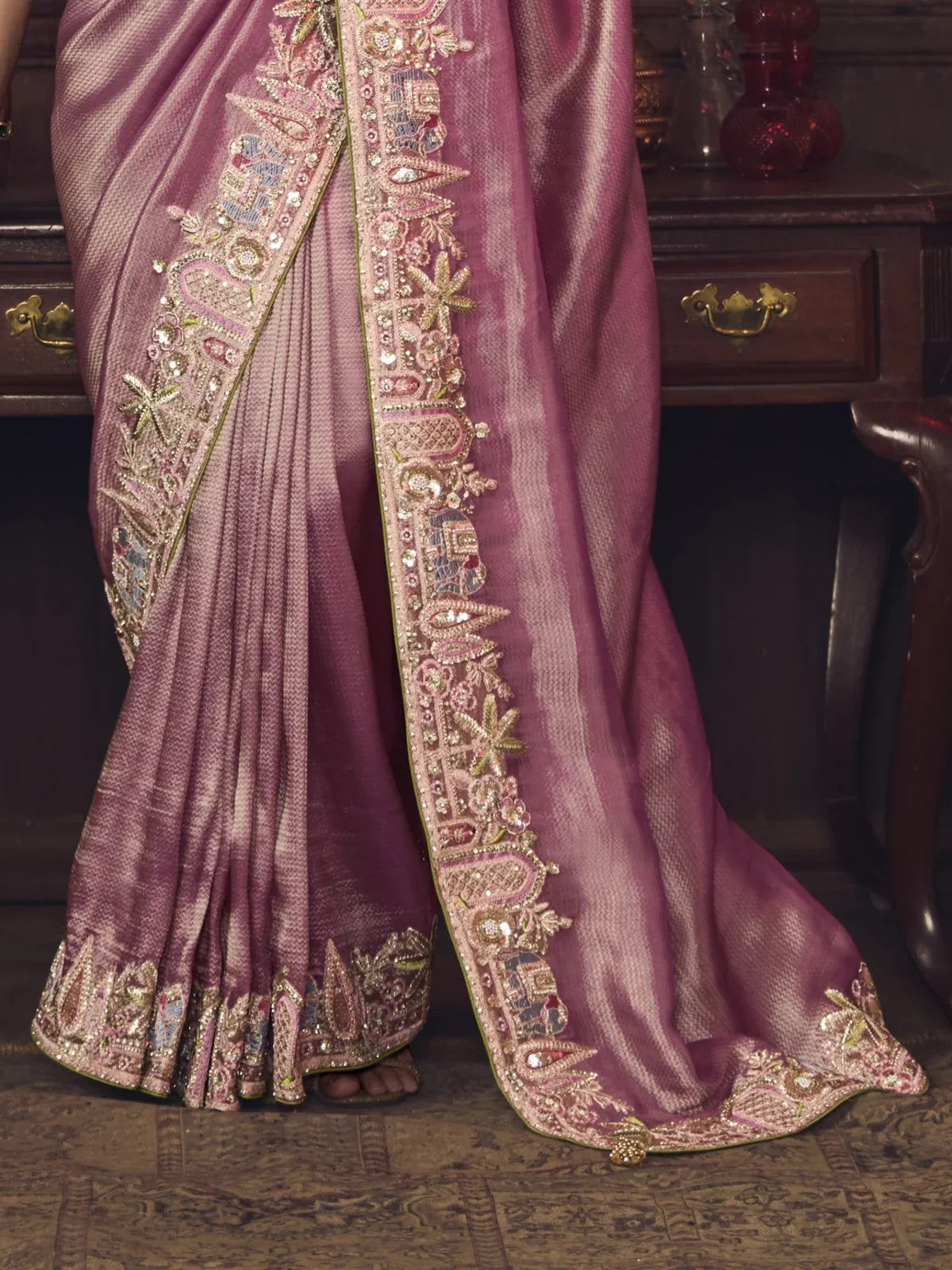 Tarani pink silk saree pallu and embroidery detailing with luxurious temple motif border
