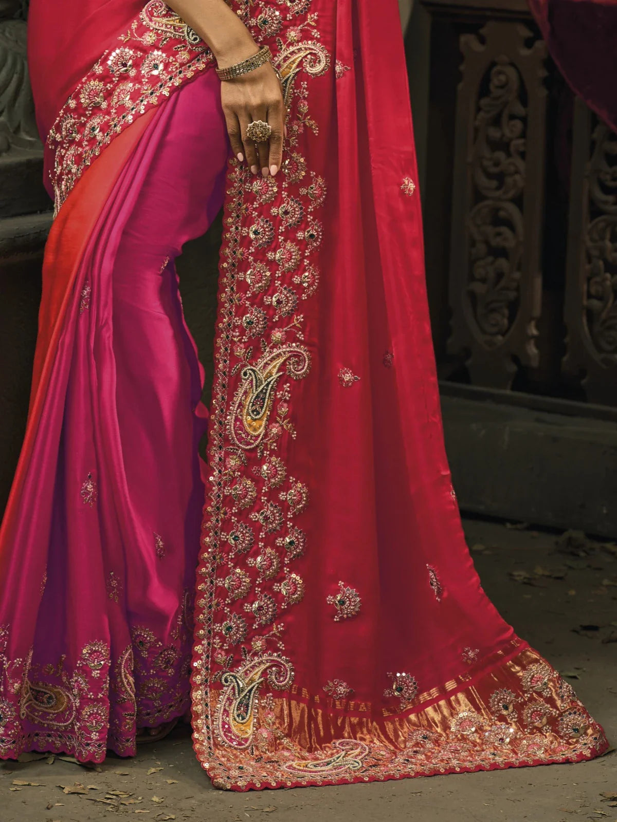 Tarani pink silk saree with intricate border and pallu embroidery in close up view