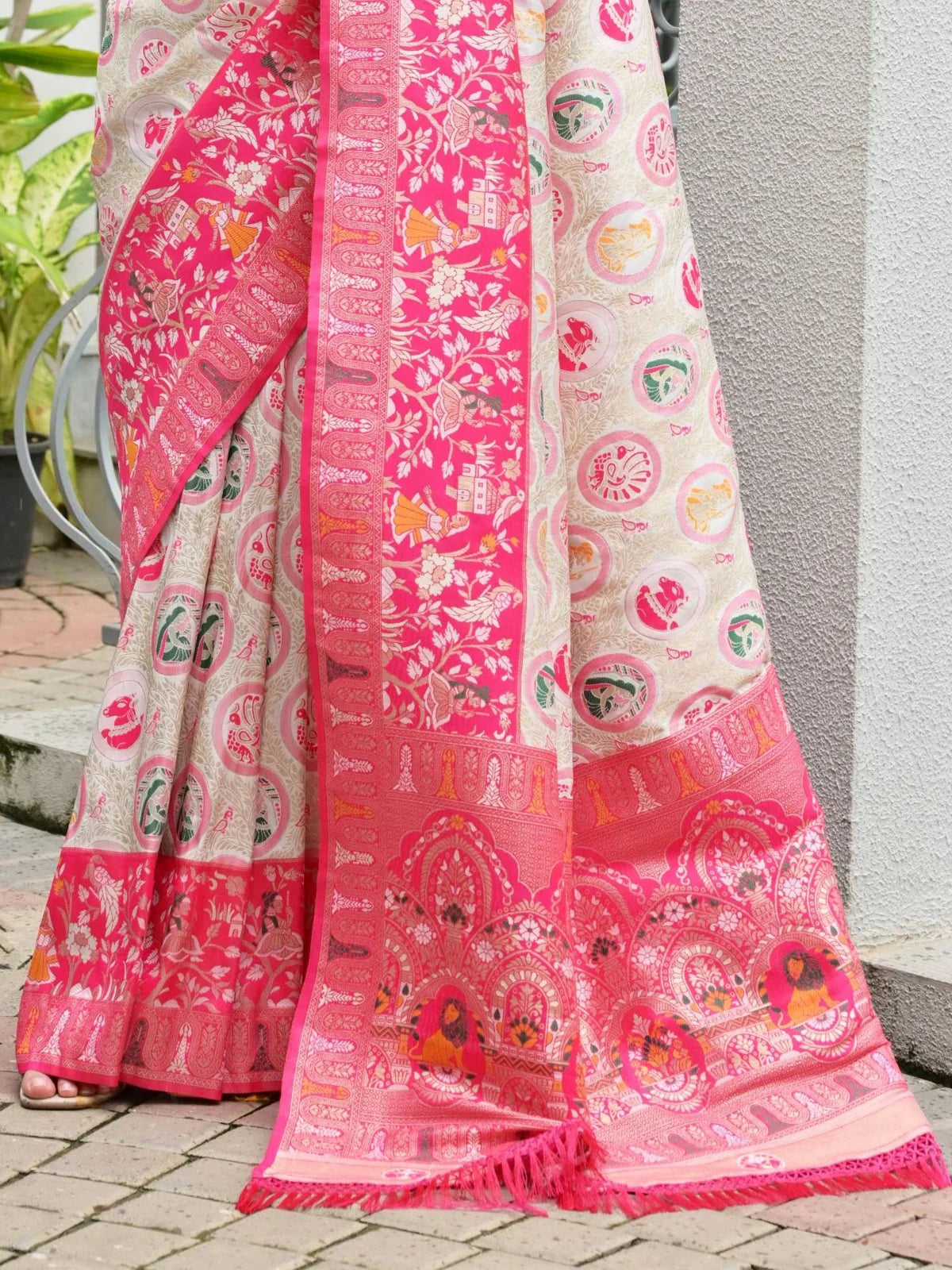 Tarani pink Banarasi saree pallu close-up with intricate zari and cultural motifs