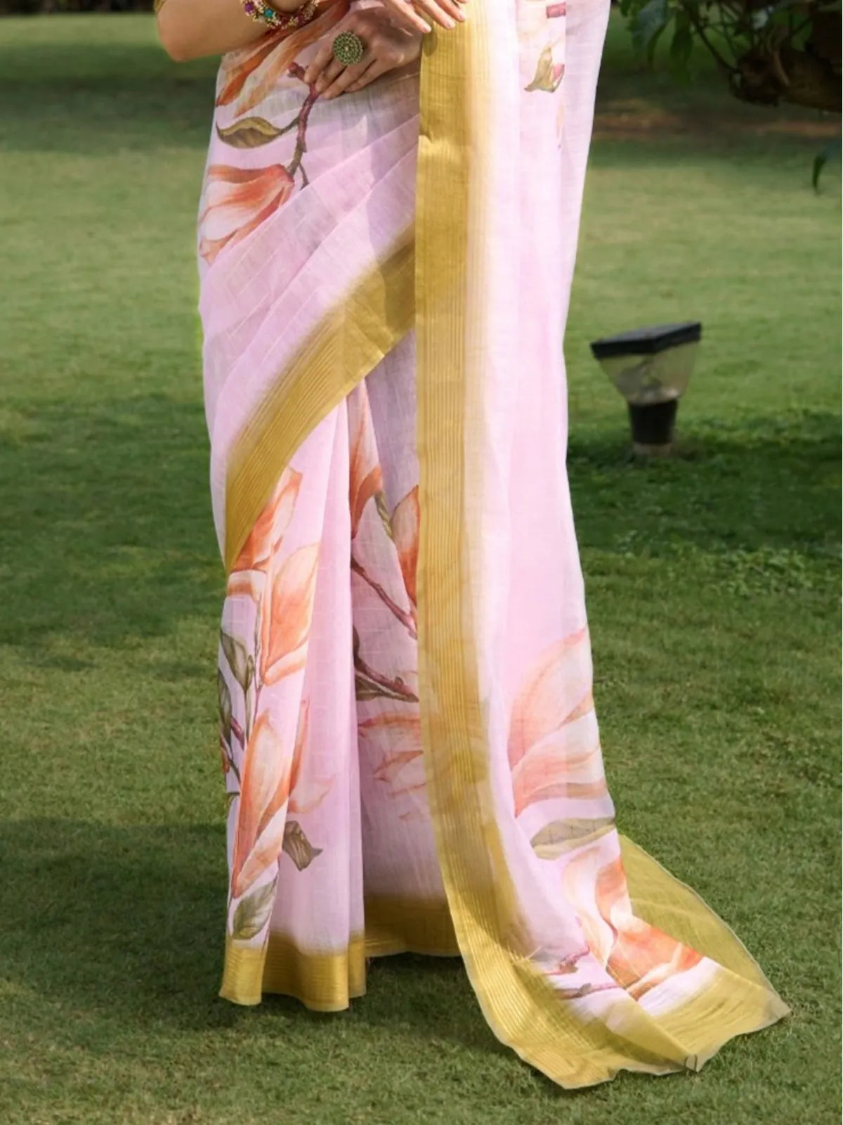Tarani pink silk saree with floral pallu design and golden border close view