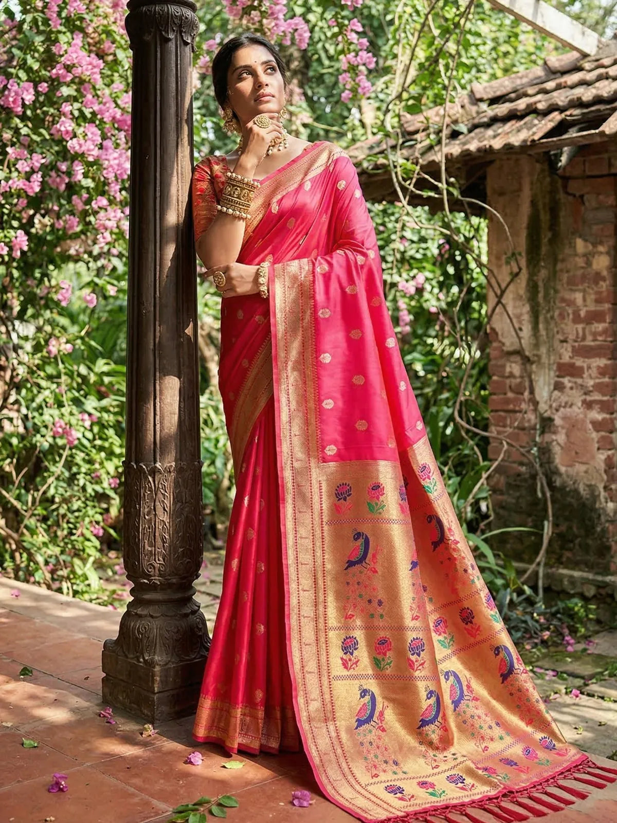 Tarani pink soft silk saree side pose highlighting contrast zari border and elegant drape