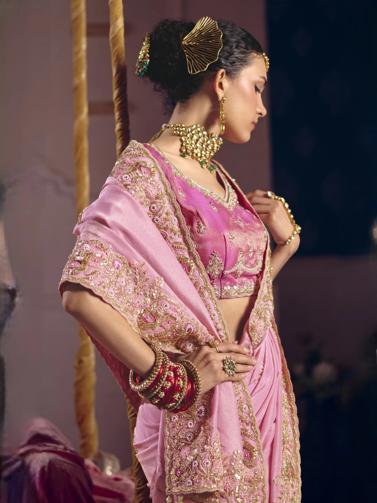 Tarani pink saree side view with heavy embroidery beed work and elegant blouse detailing