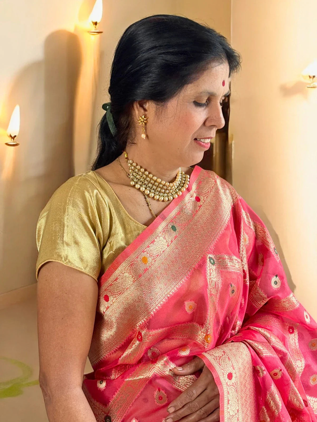 Tarani pink silk saree upper body view with golden blouse and zari border