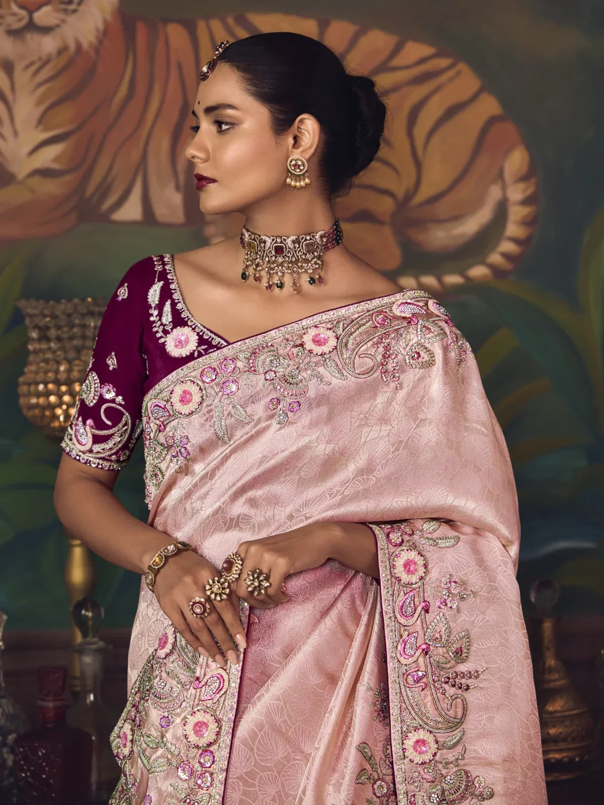 Tarani elegant upper body view of pink silk saree paired with rich maroon blouse and intricate jewellery