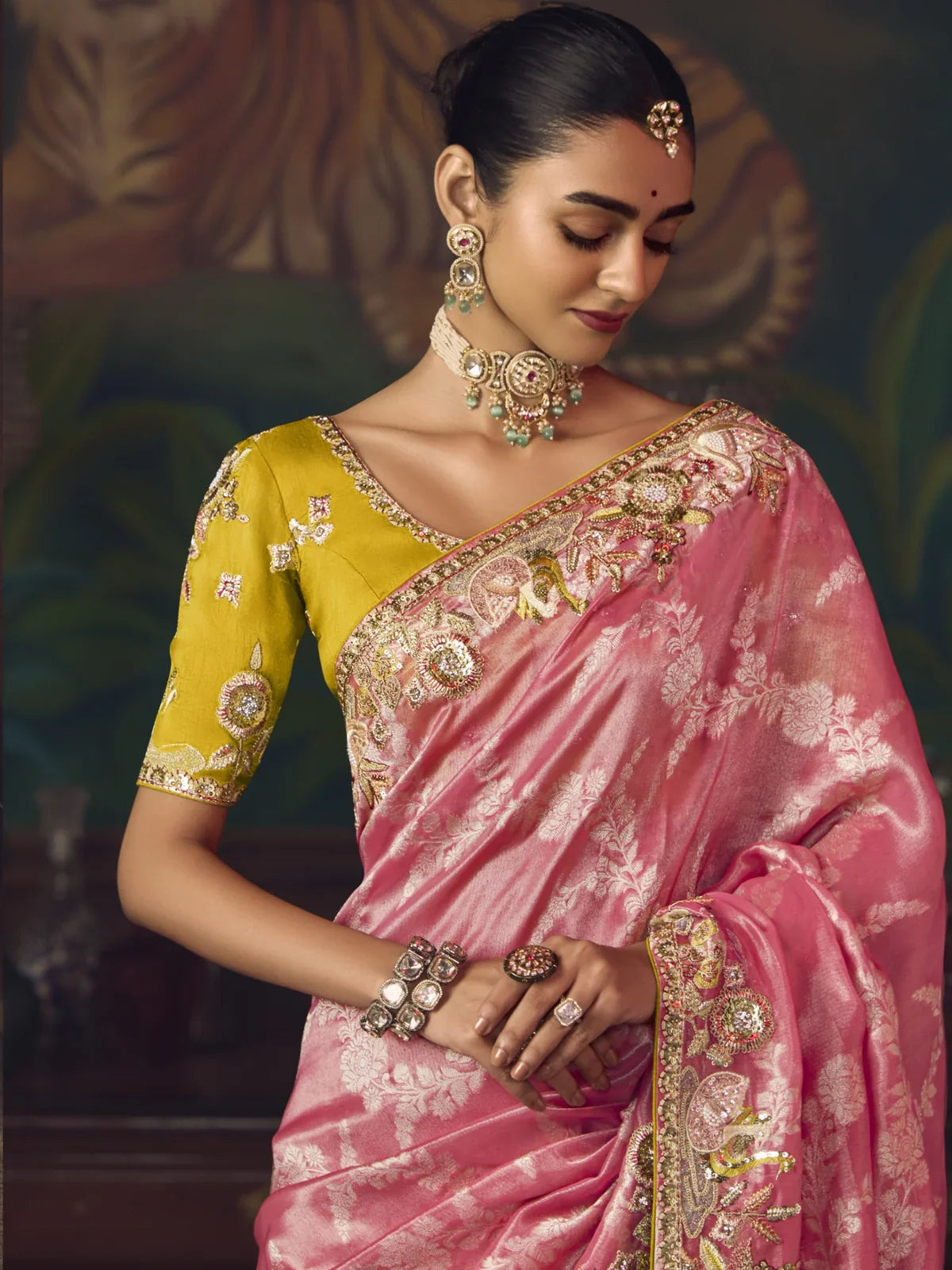 Tarani pink embroidered saree with detailed closeup of yellow designer blouse and jewellery