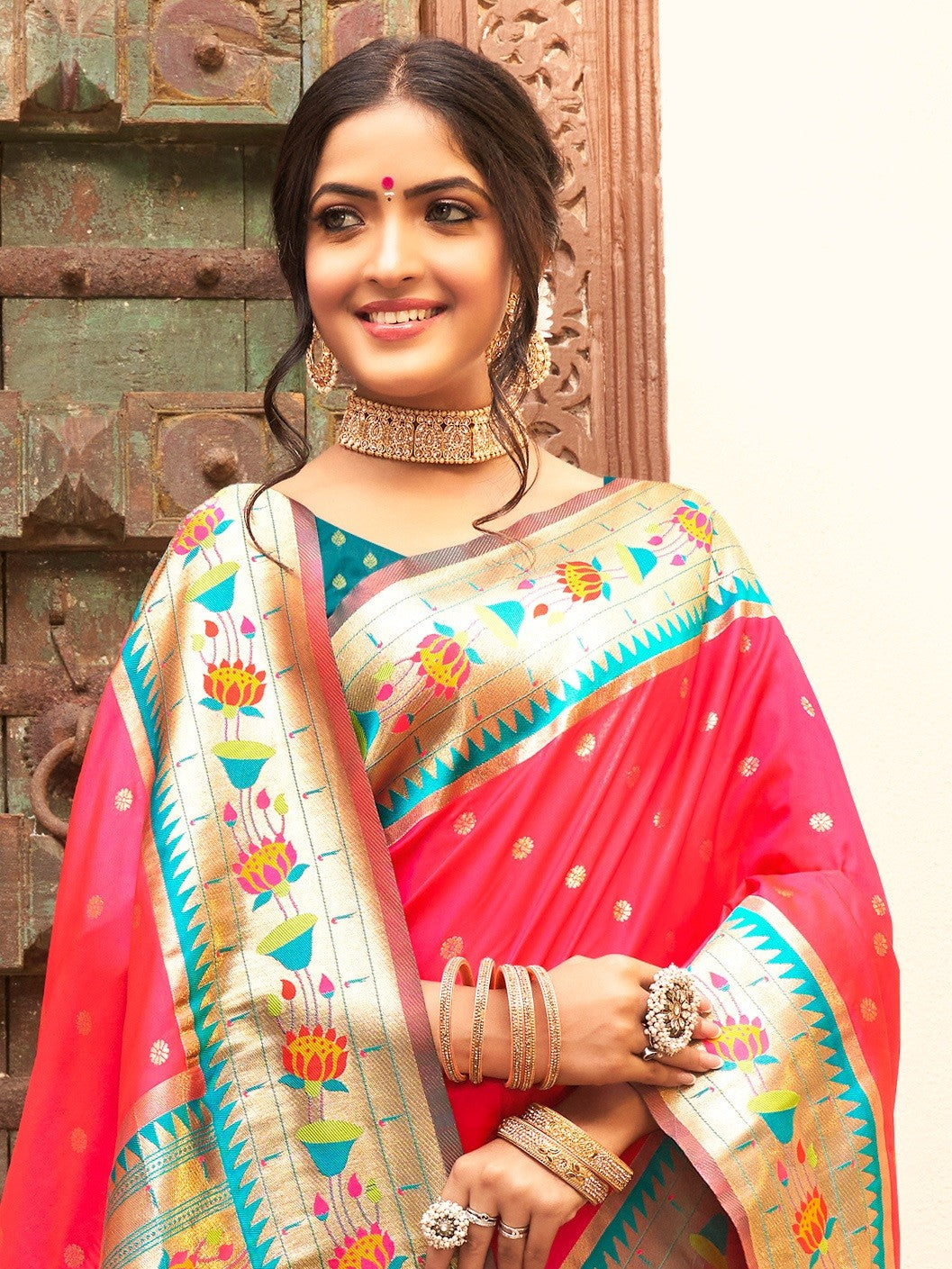 Tarani elegant pink Paithani silk saree with zari border upper body view styled with jewelry