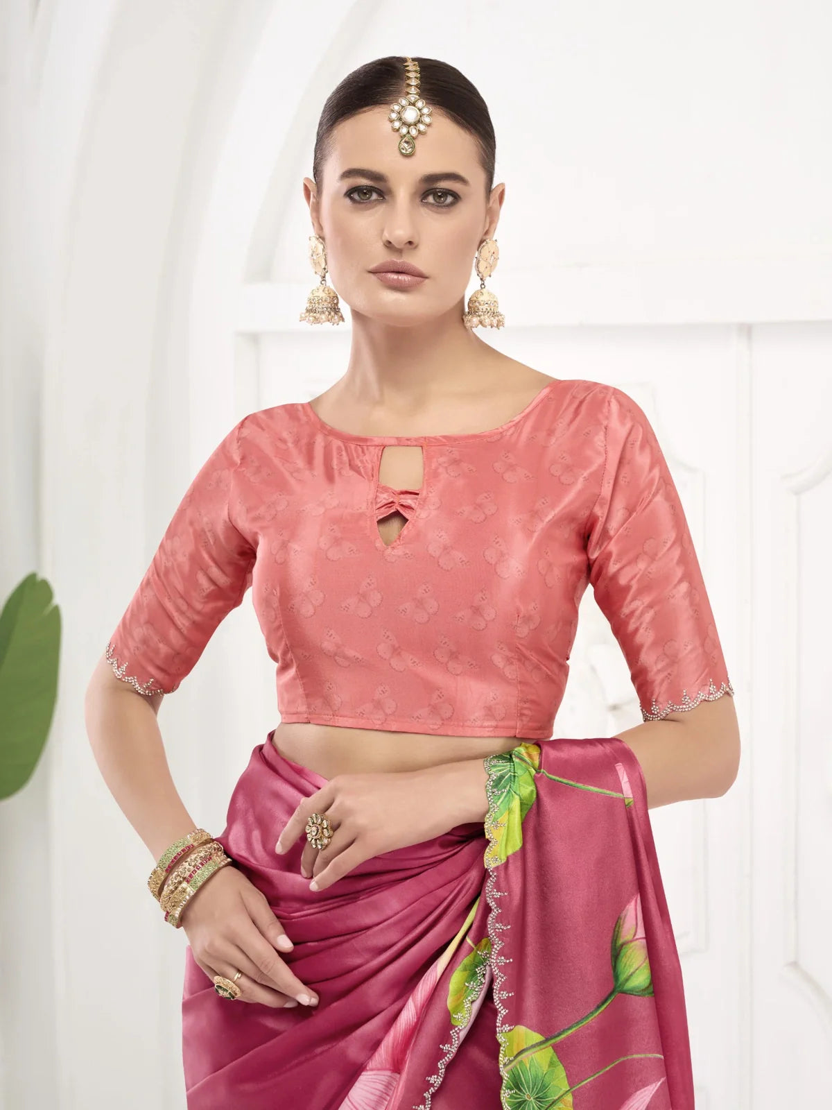 Tarani elegant pink saree with stylish blouse front and jewelry upper body view