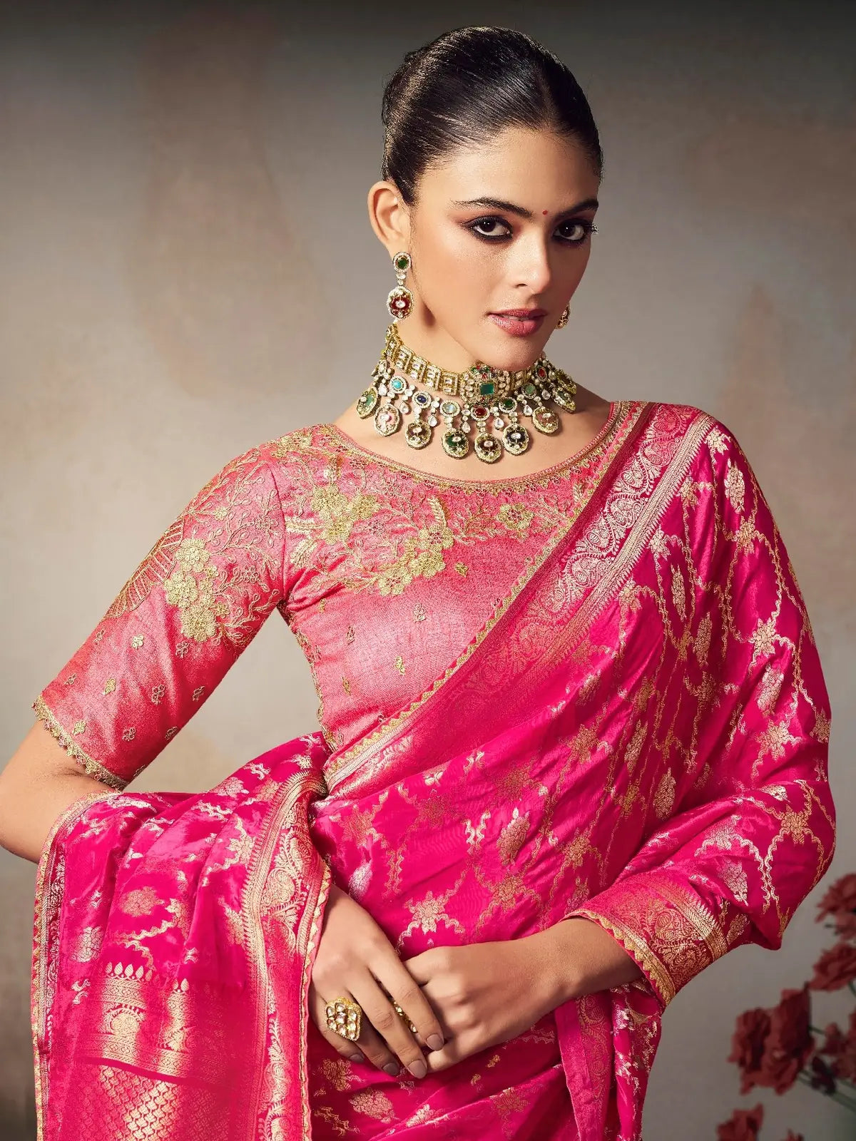 Tarani pink silk saree upper body close-up showing blouse embroidery and jewelry