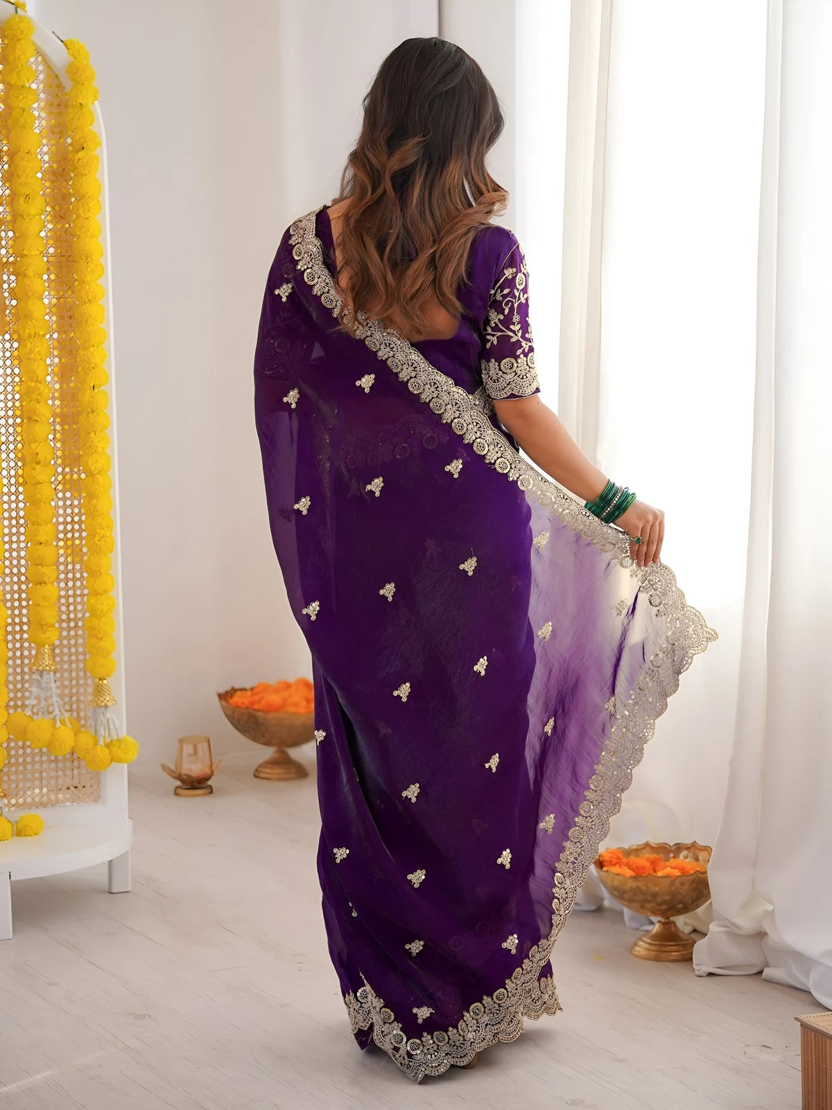 Tarani purple saree back view with embroidered blouse and ornate border detailing