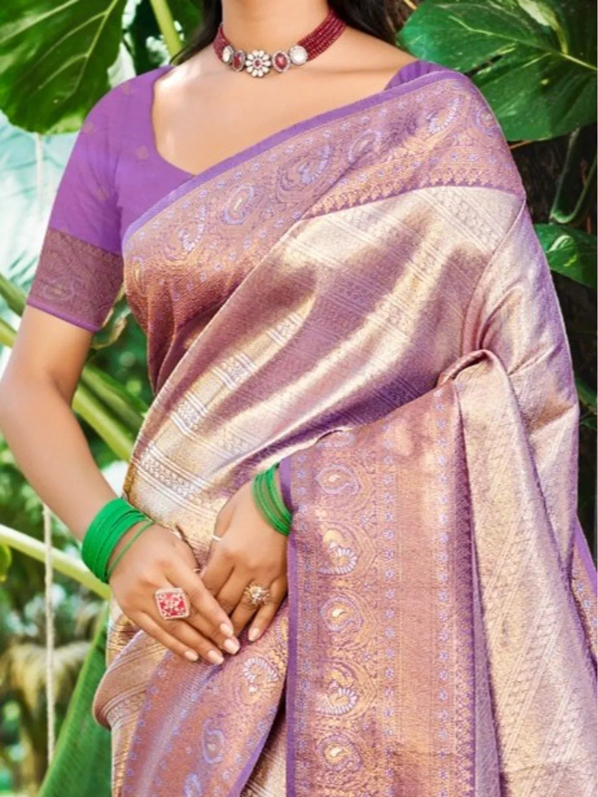 Tarani kanjivaram silk saree closeup view in purple with golden weaving details