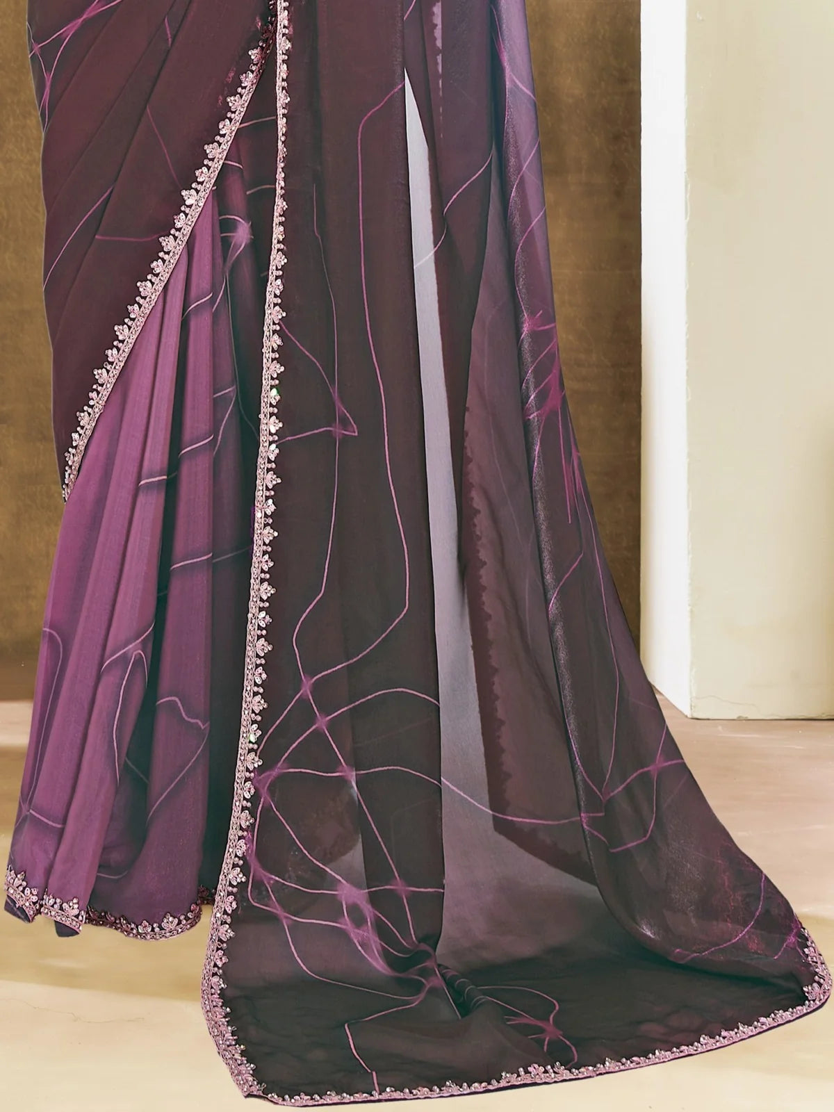 Tarani Archisha purple satin silk saree pallu view showing abstract print and embellished border