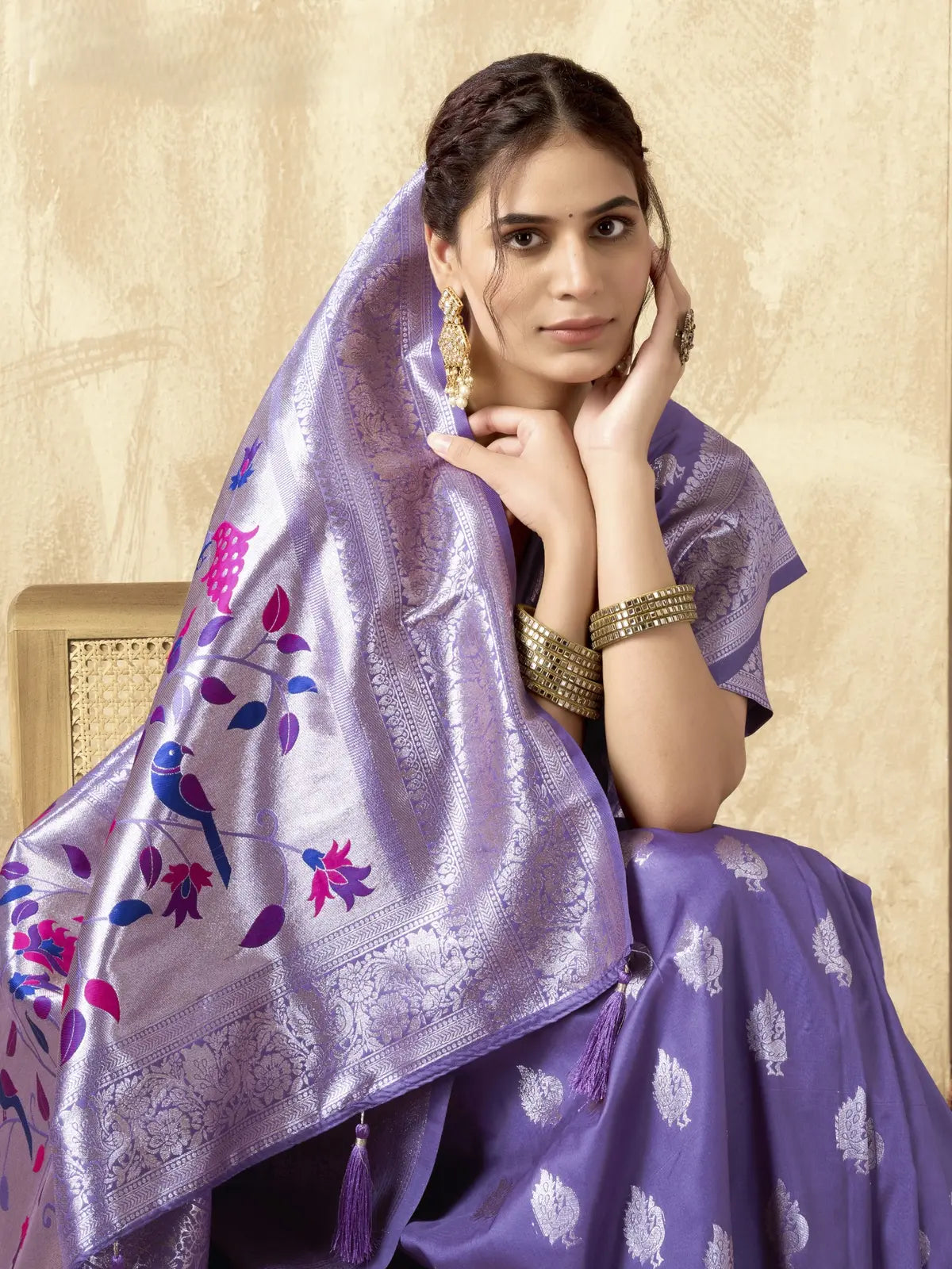 Tarani purple silk saree pallu view with floral tassels and weaving detail