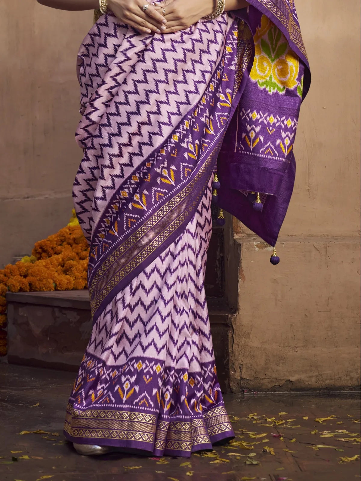 Tarani purple silk saree pallu view with embroidery and tassels