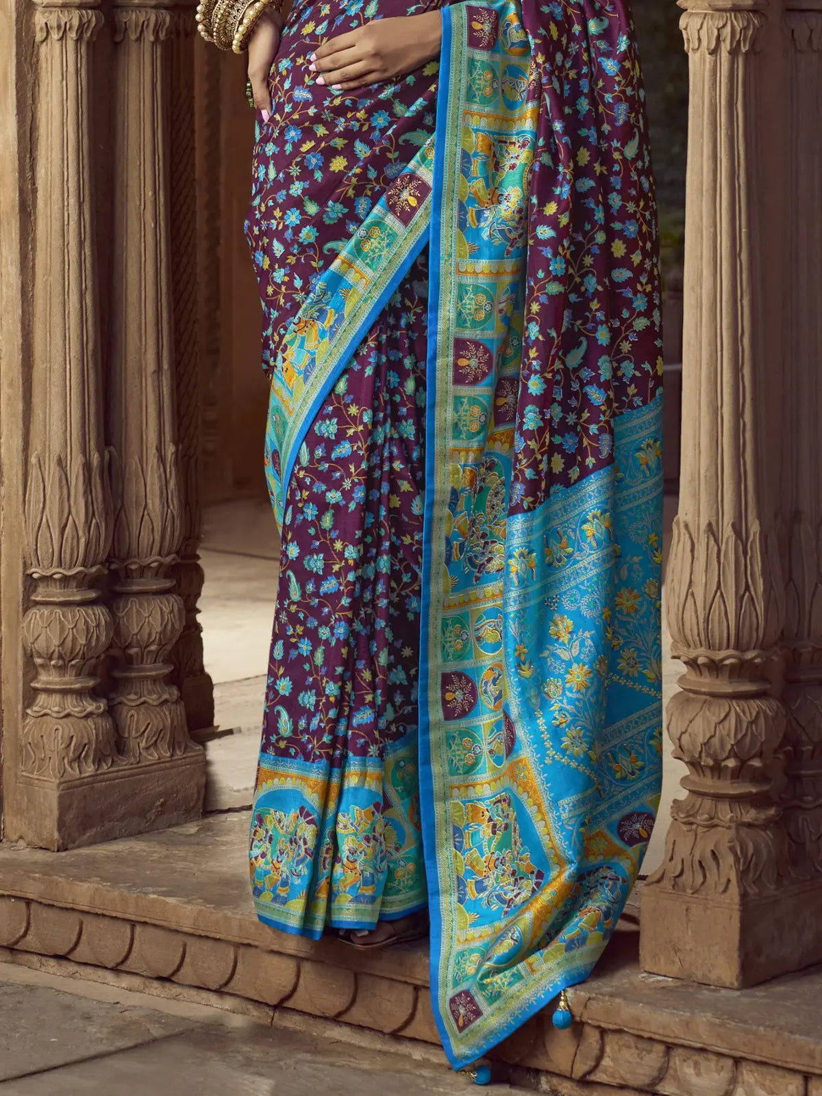 Tarani purple silk saree pallu view showing turquoise border and detailed design