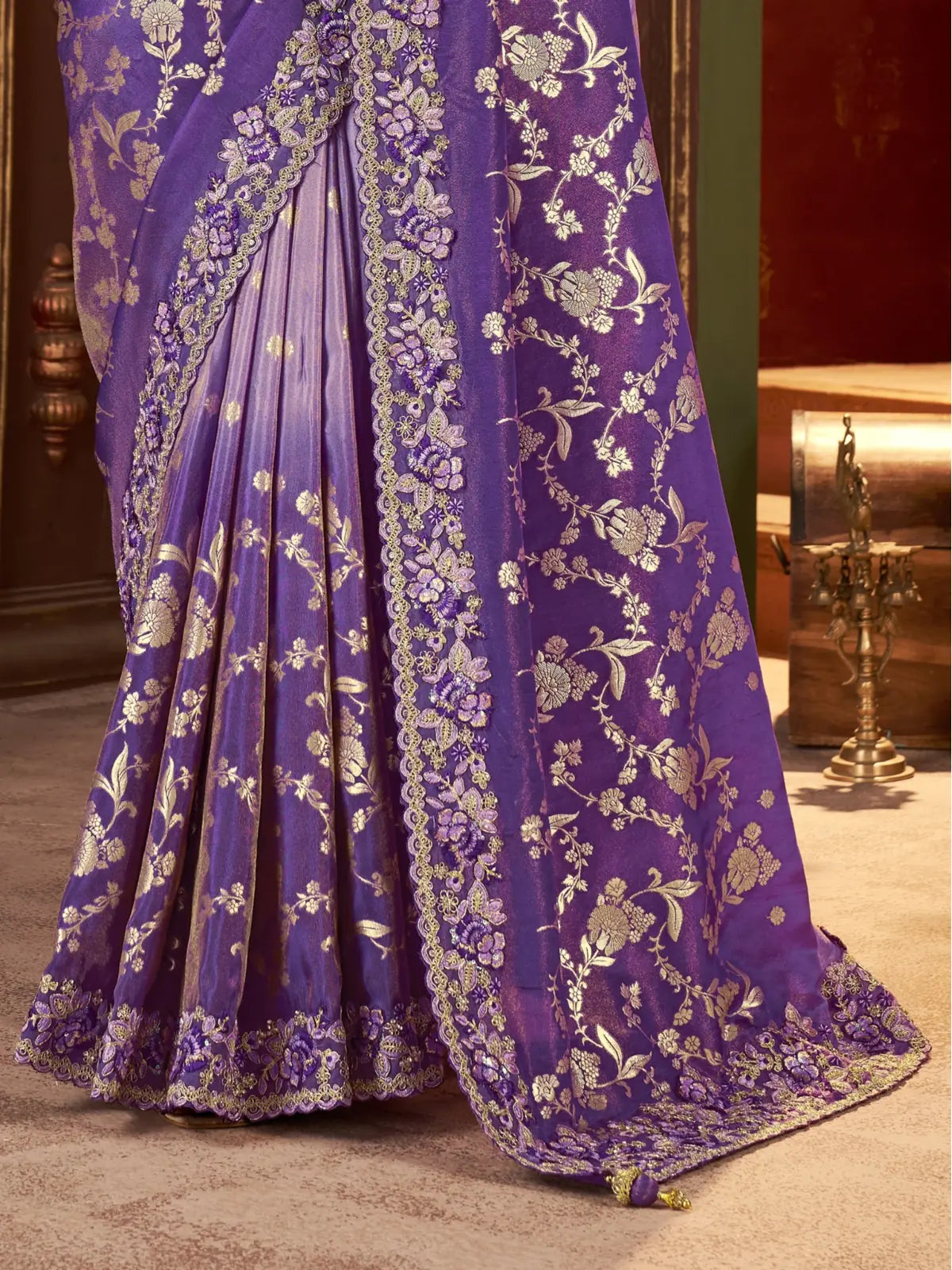 Tarani purple saree pallu and border close-up with golden zari work and latkan