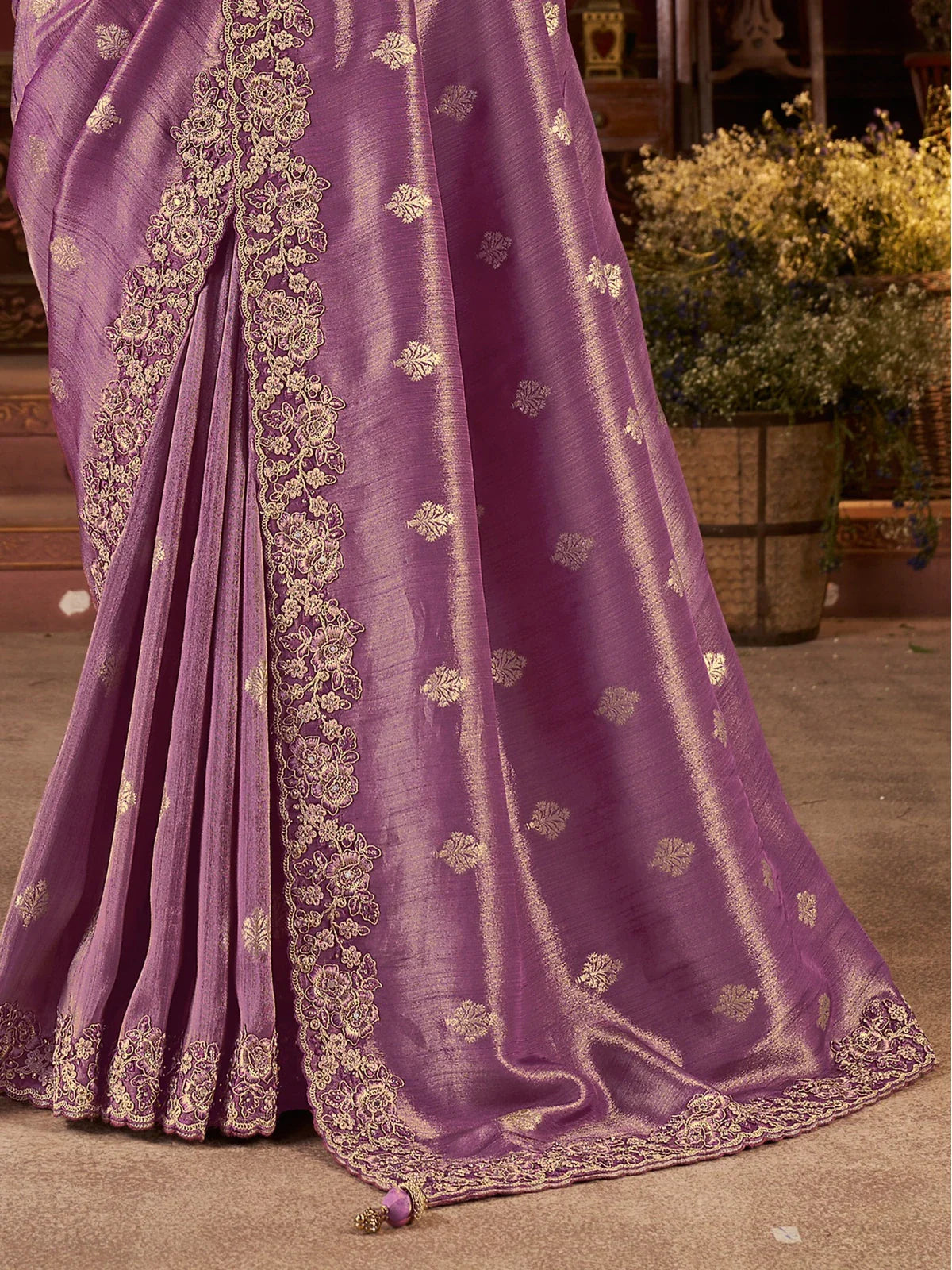 Tarani soft silk saree in purple with rich zari border and tassels on pallu in detailed view