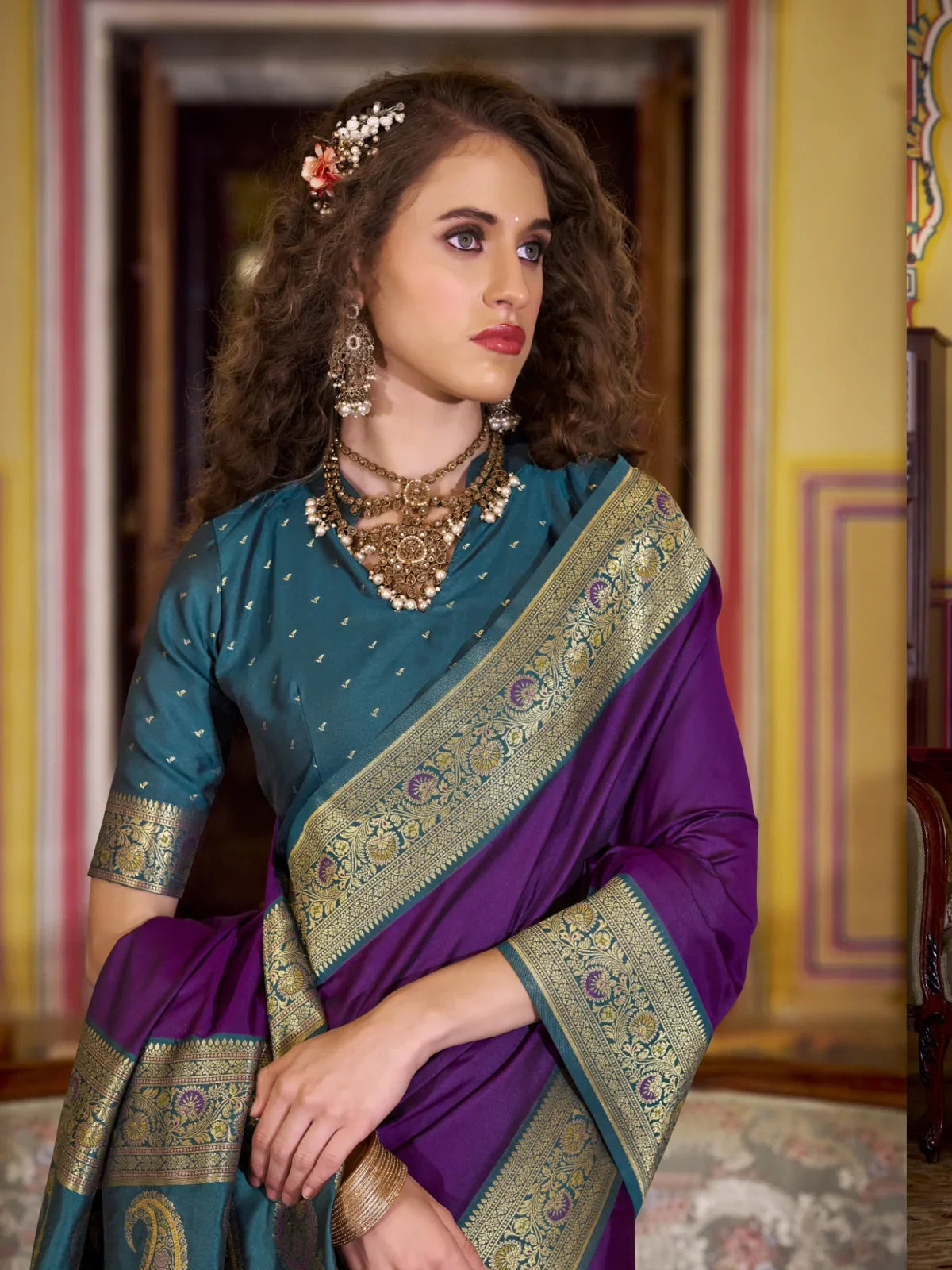 Tarani purple silk saree upper body view with teal blouse and intricate zari border