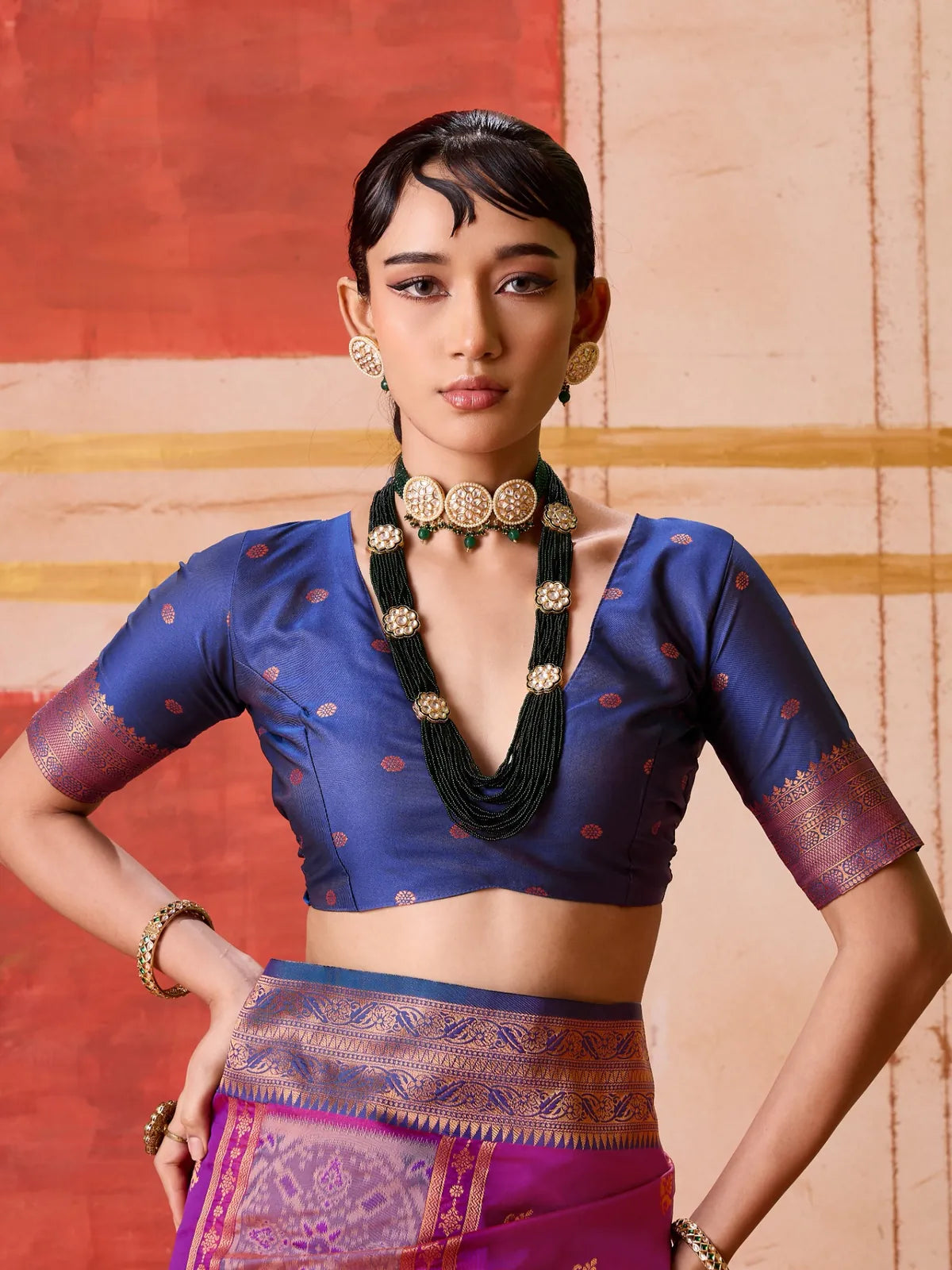 Tarani purple silk saree upper body view with deep blue blouse and traditional jewellery