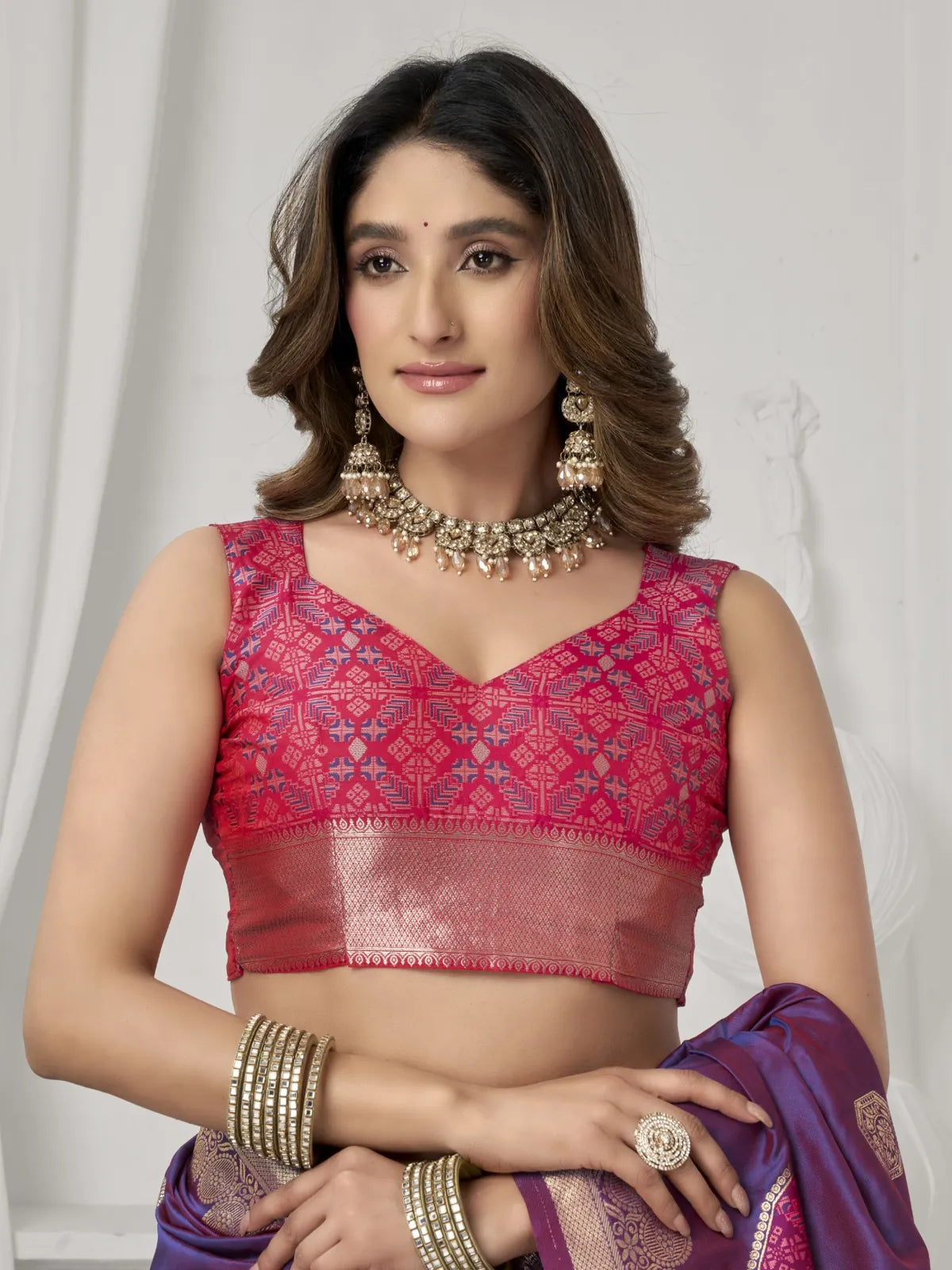 Tarani purple silk saree upper body closeup showing red embroidered blouse design