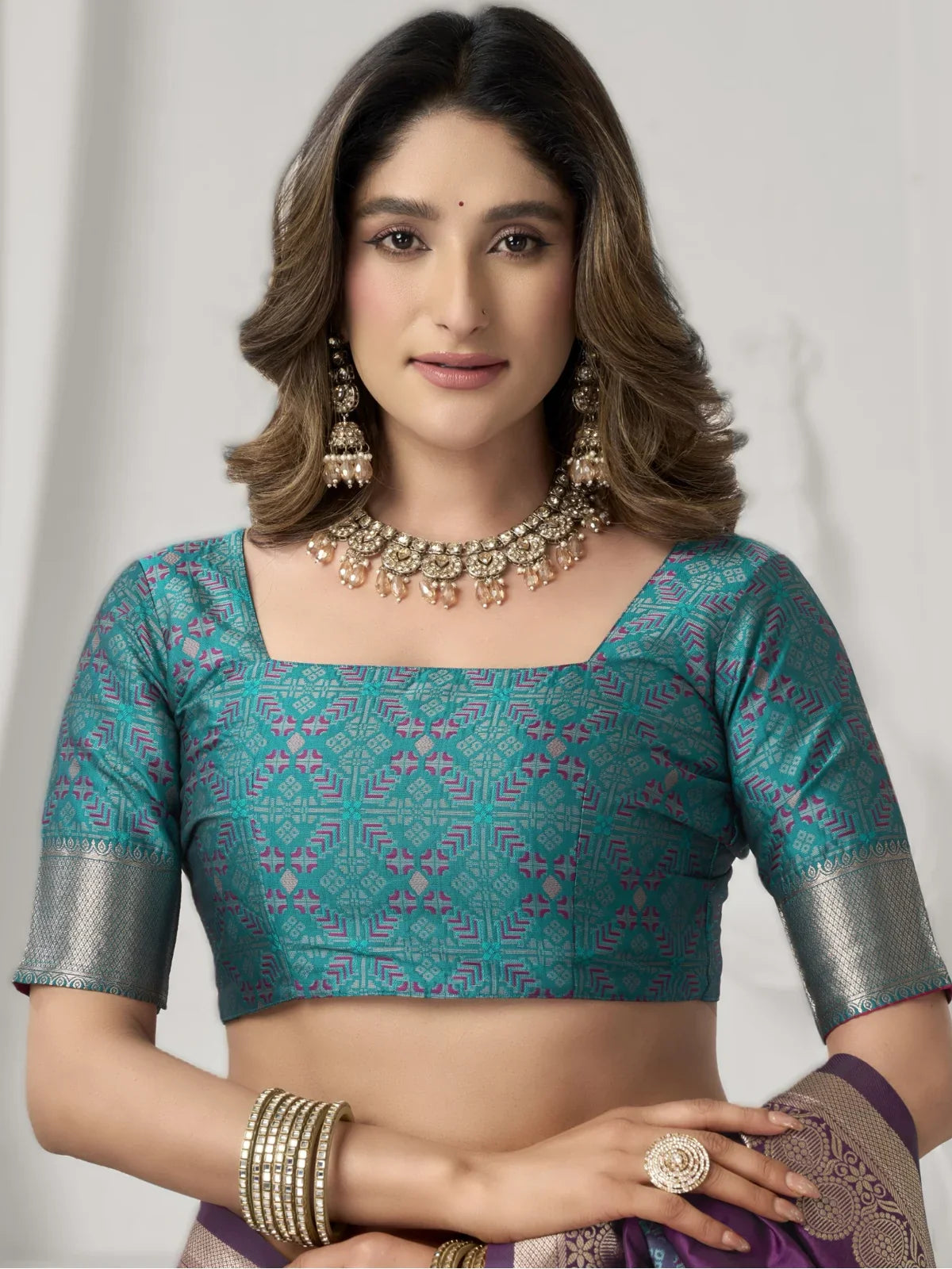 Tarani silk saree blouse in teal with geometric weave and elbow sleeves