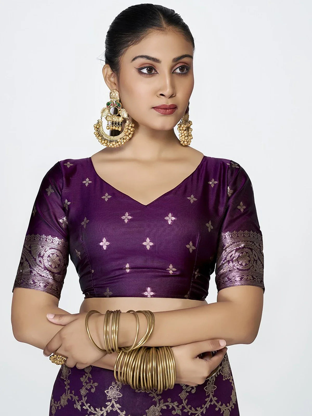Tarani purple silk saree blouse with elbow sleeves and intricate weaving upper body closeup