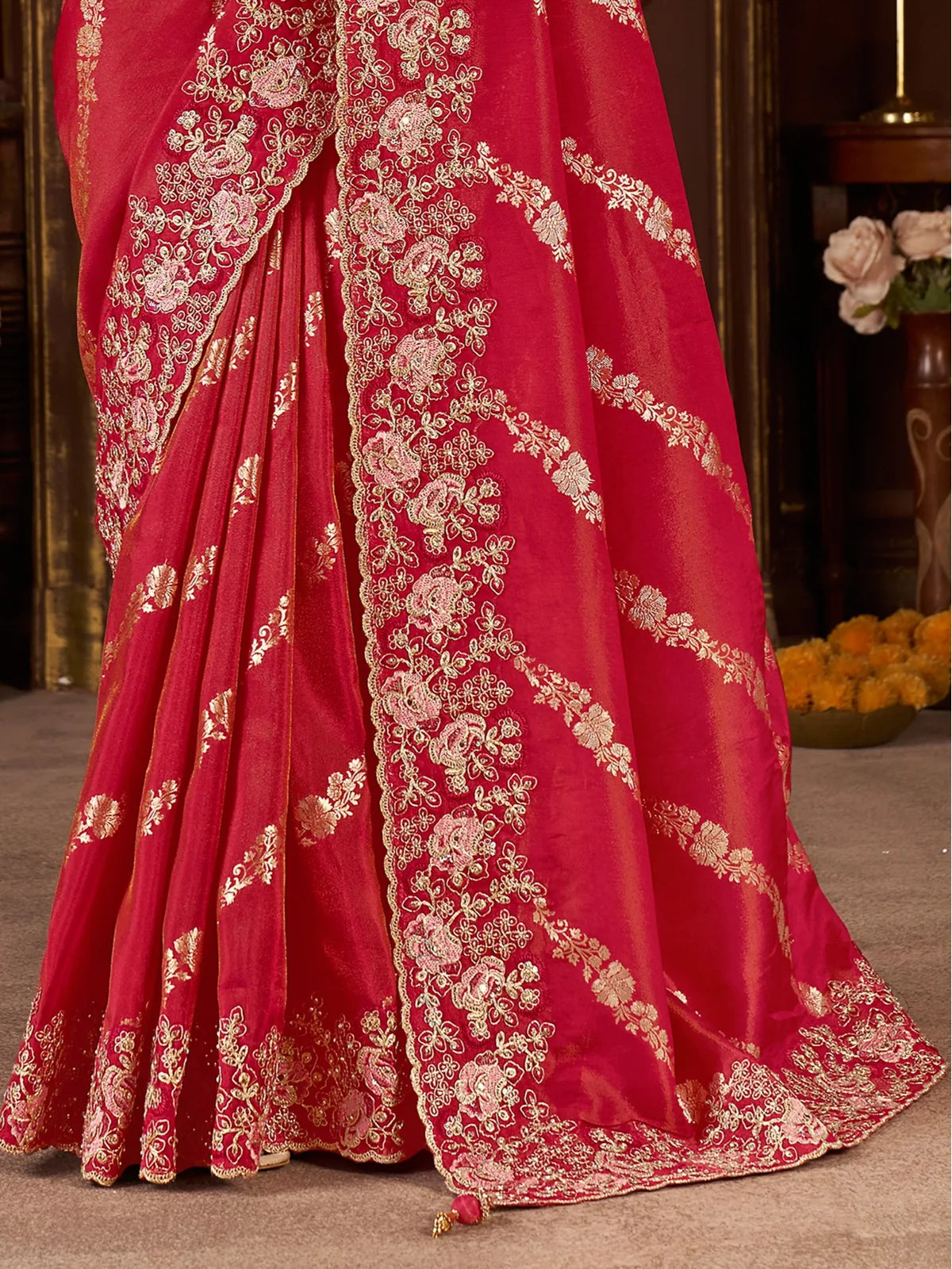 Tarani red silk saree closeup view highlighting zari embroidery and fabric texture