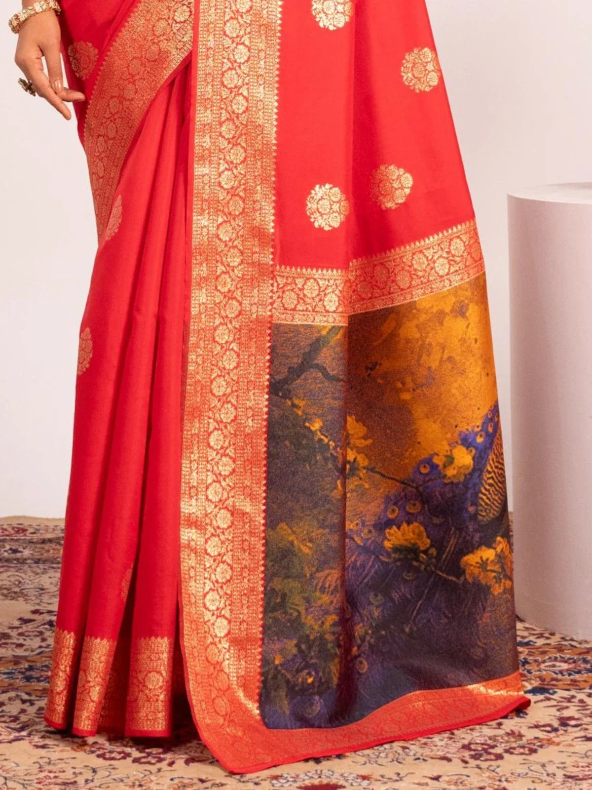 Tarani banarasi silk saree pallu closeup in red and navy with artistic resham peacock weaving