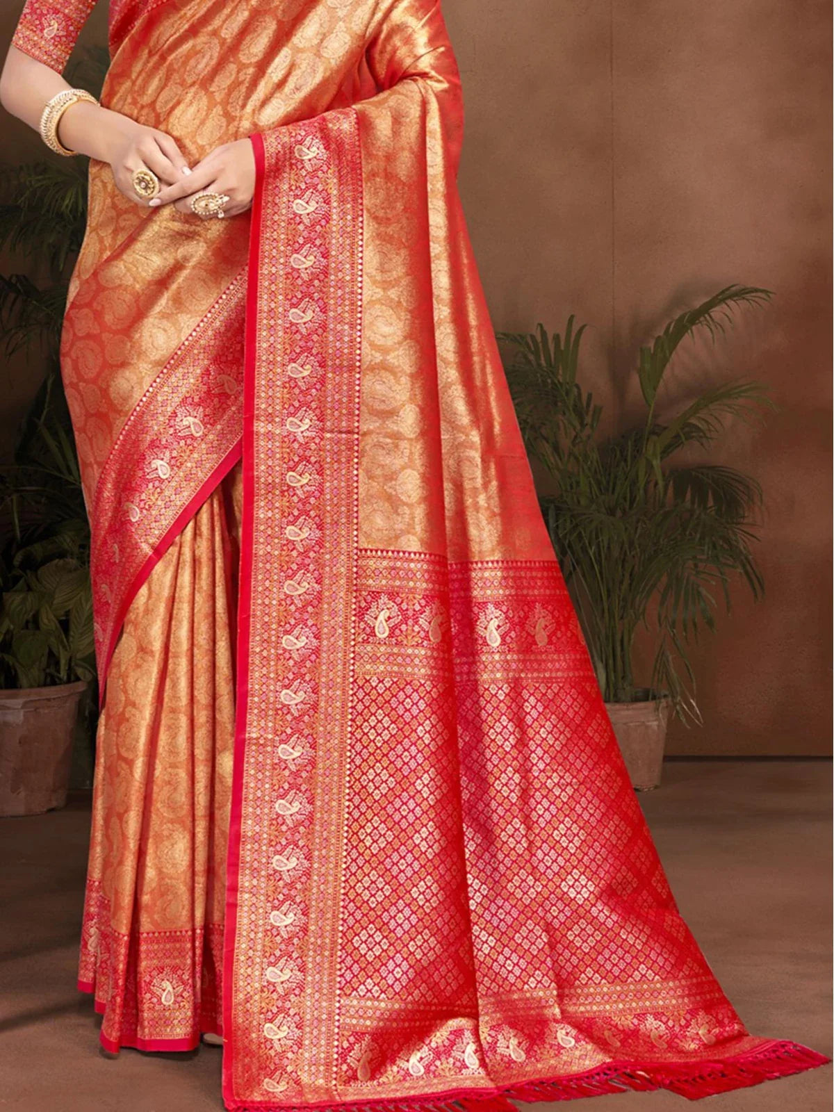 Tarani red Kanjivaram silk saree pallu view highlighting rich woven zari patterns
