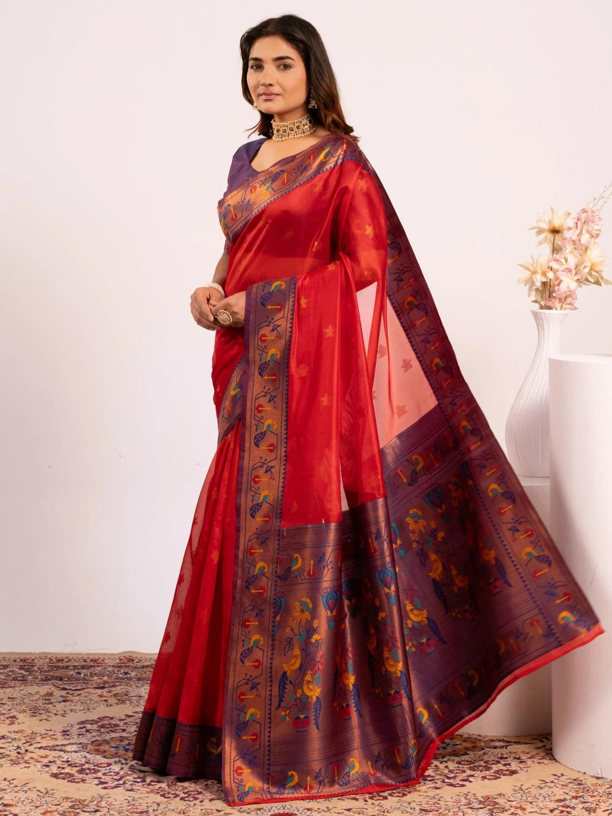 Tarani red Soft Tissue Silk saree side view displaying elegant drape and woven border