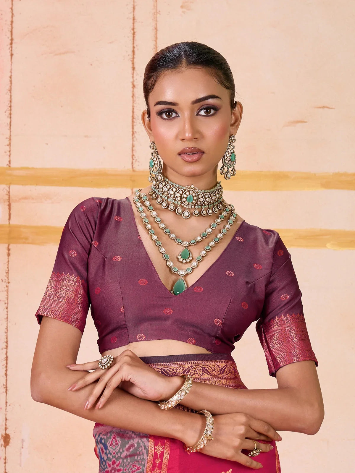 Tarani upper body close-up showing blouse design and elegant red silk texture