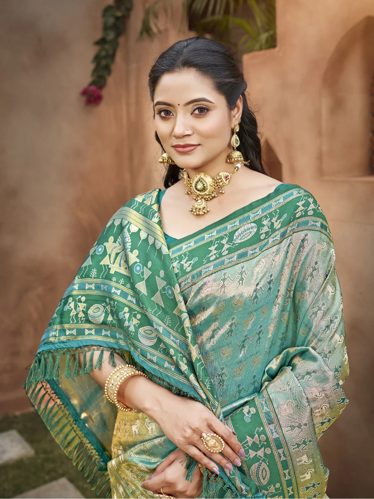 Tarani sea green kanjivaram silk saree upper body close view showing intricate zari work