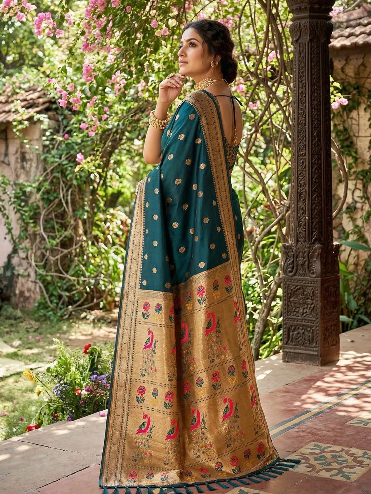 Tarani teal soft silk saree back view showcasing pallu artwork and drape